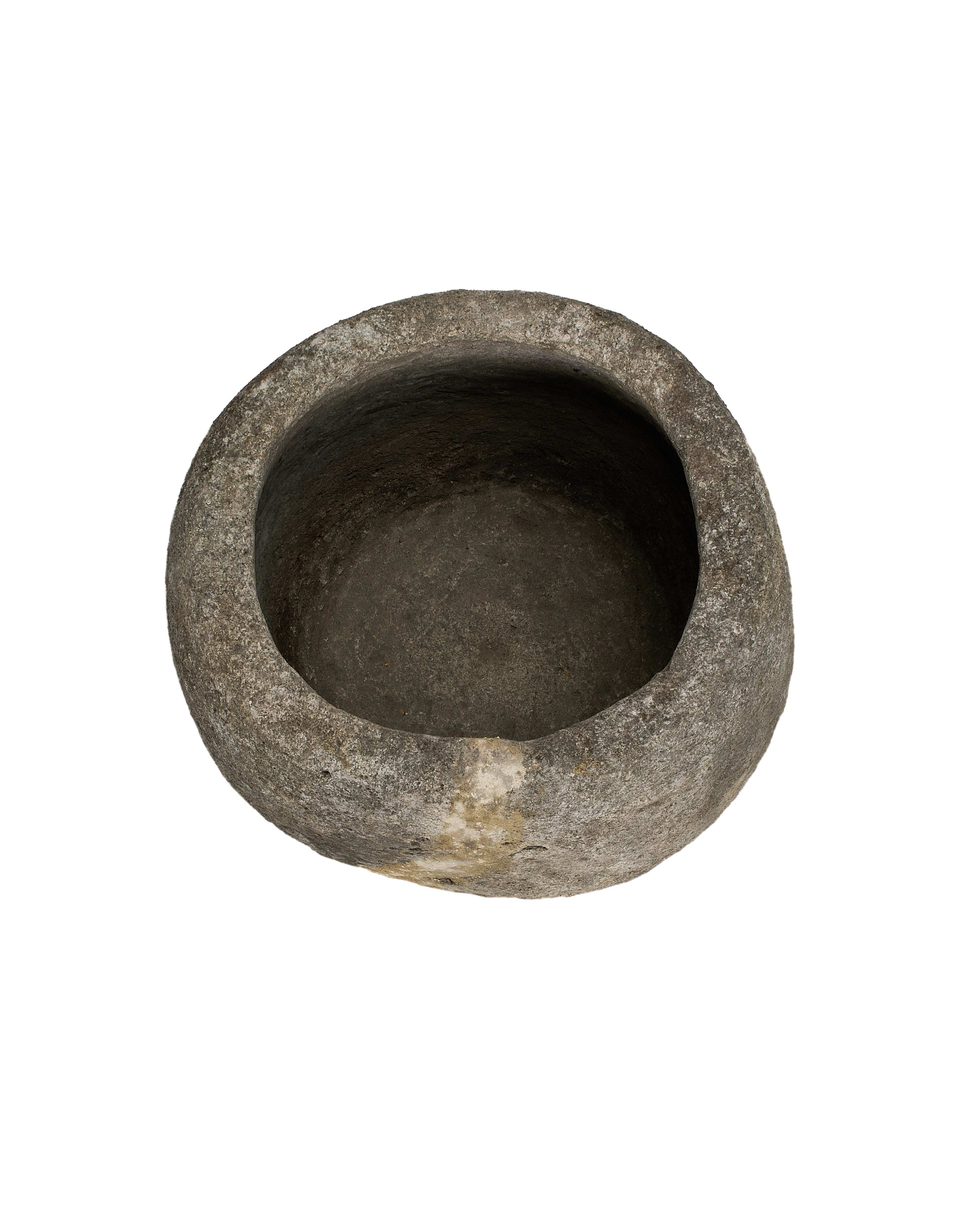Vintage Indonesian round limestone trough, top view revealing rough interior texture and weathered external surface.