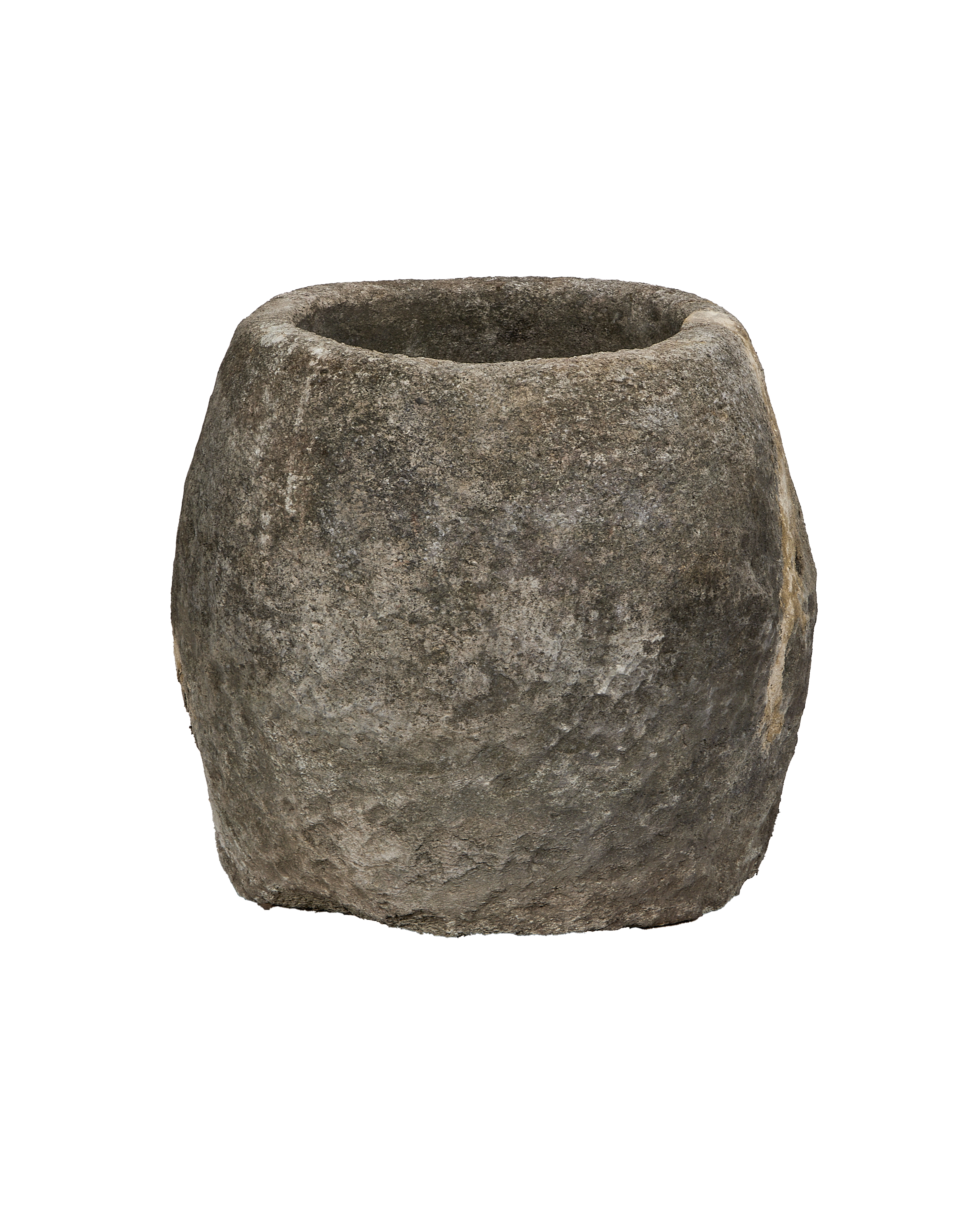 Vintage Indonesian round limestone trough, showing its rough, weathered texture and tapered top.