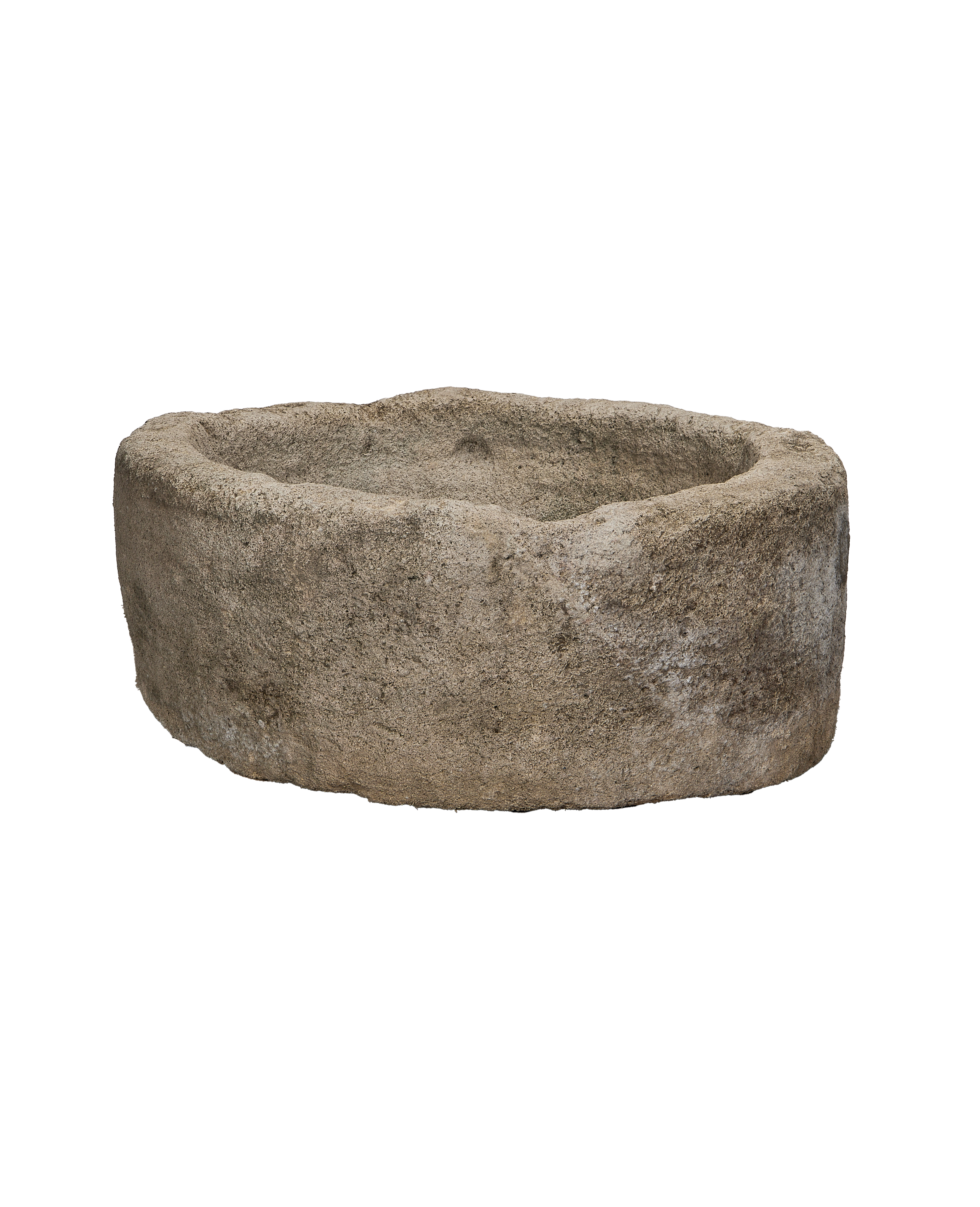 Vintage round Indonesian limestone trough, showing internal and external textural details from a lower angle.