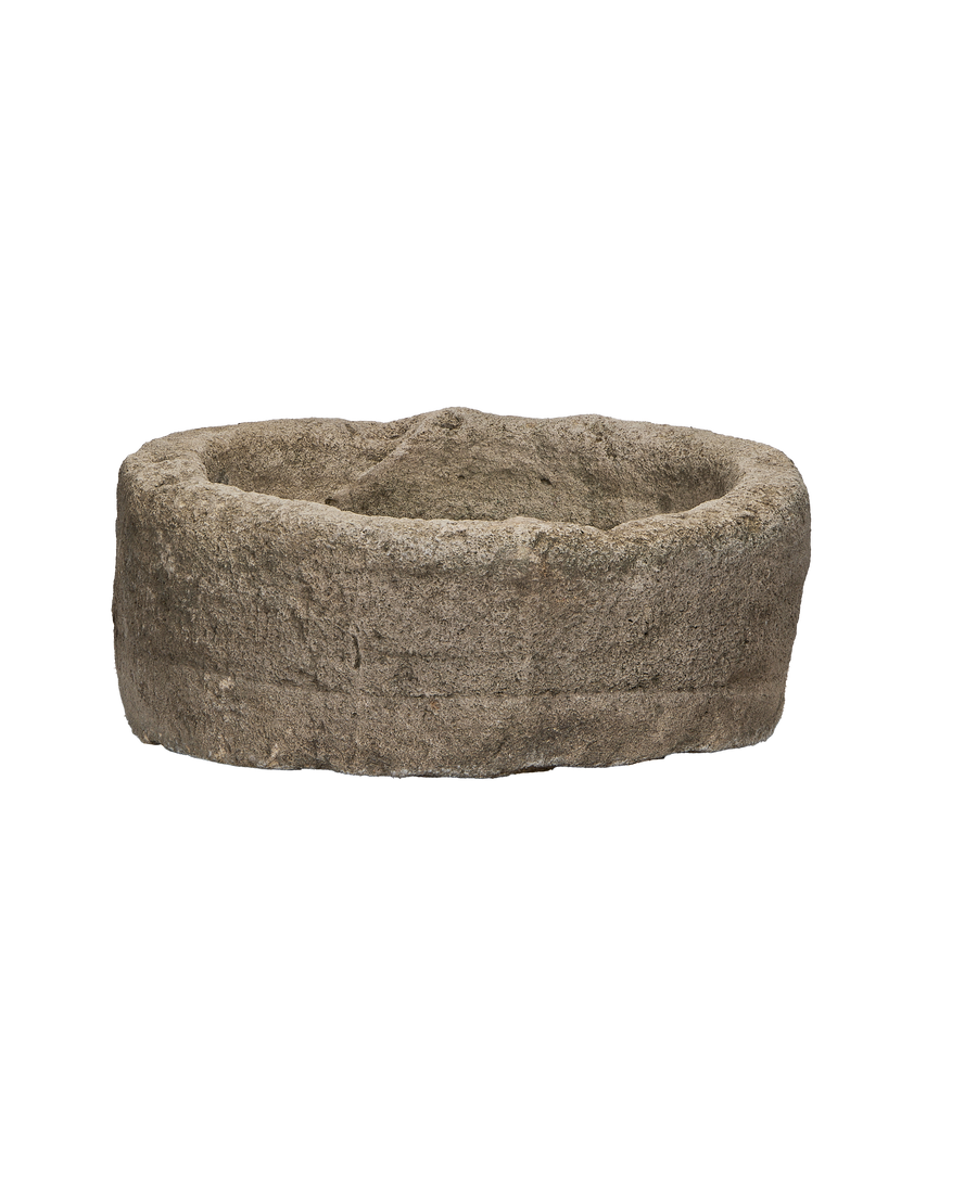 Vintage Indonesian limestone trough, round, showing detailed rough finish and aged texture.