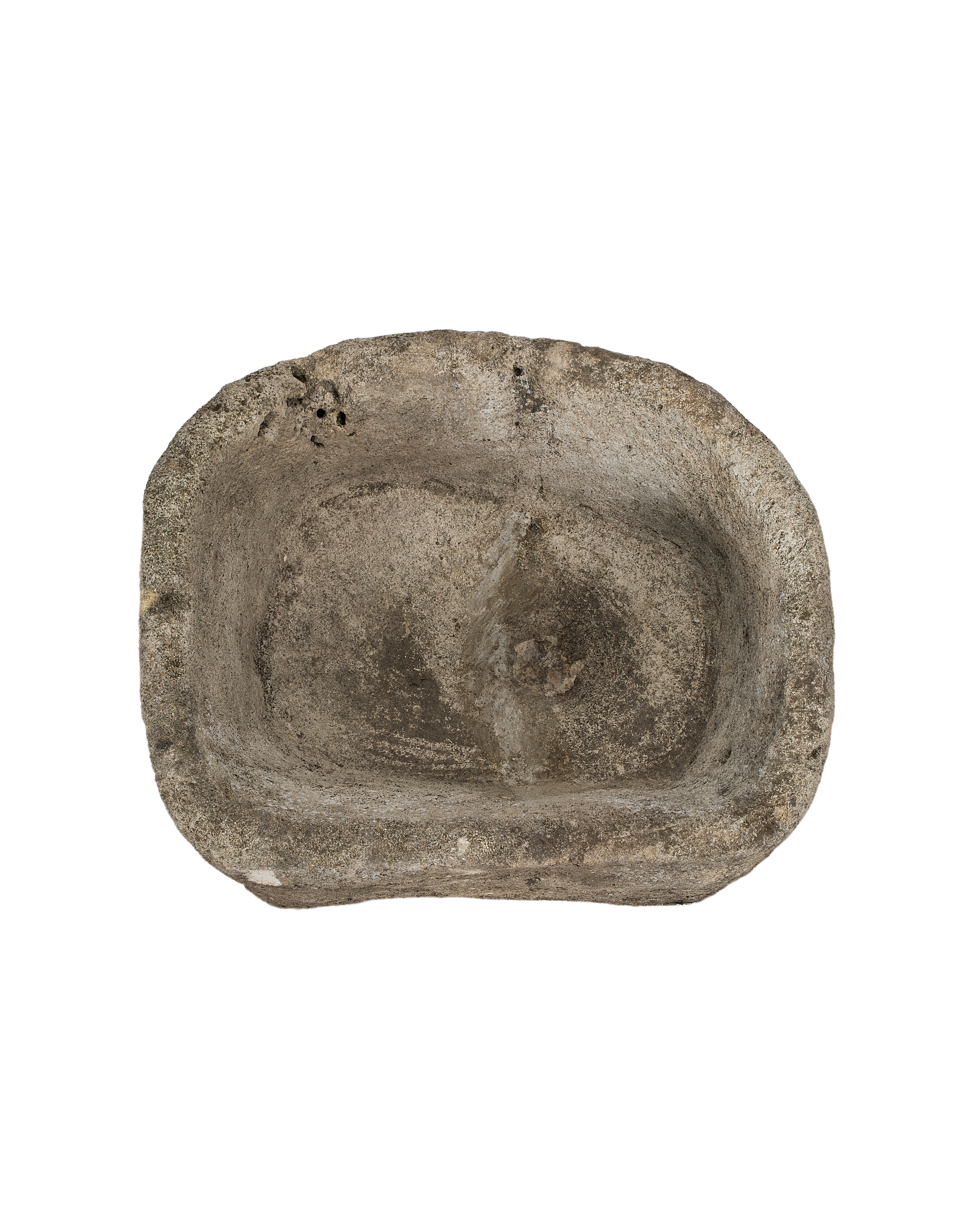 Top view of vintage Indonesian oblong limestone trough, showing weathered texture and interior basin.