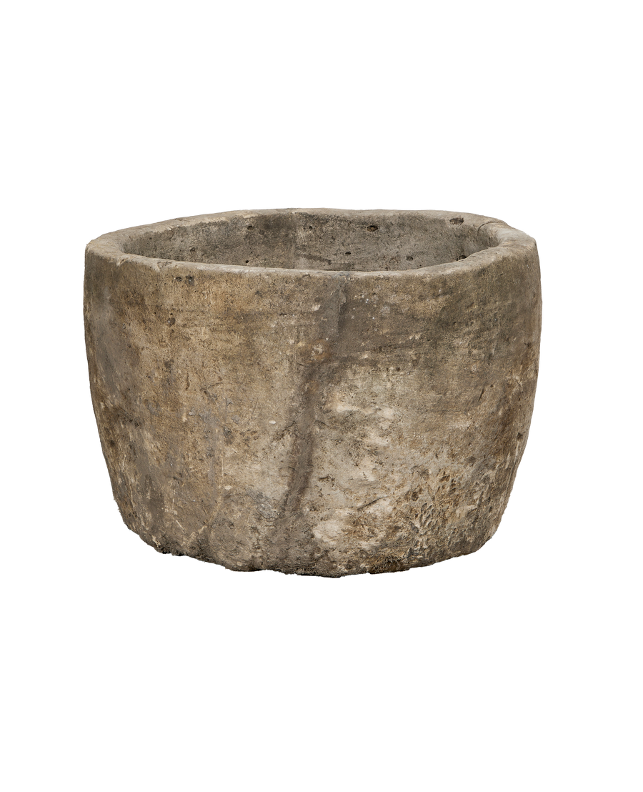 Vintage Indonesian round limestone trough, showcasing textured exterior with natural wear.