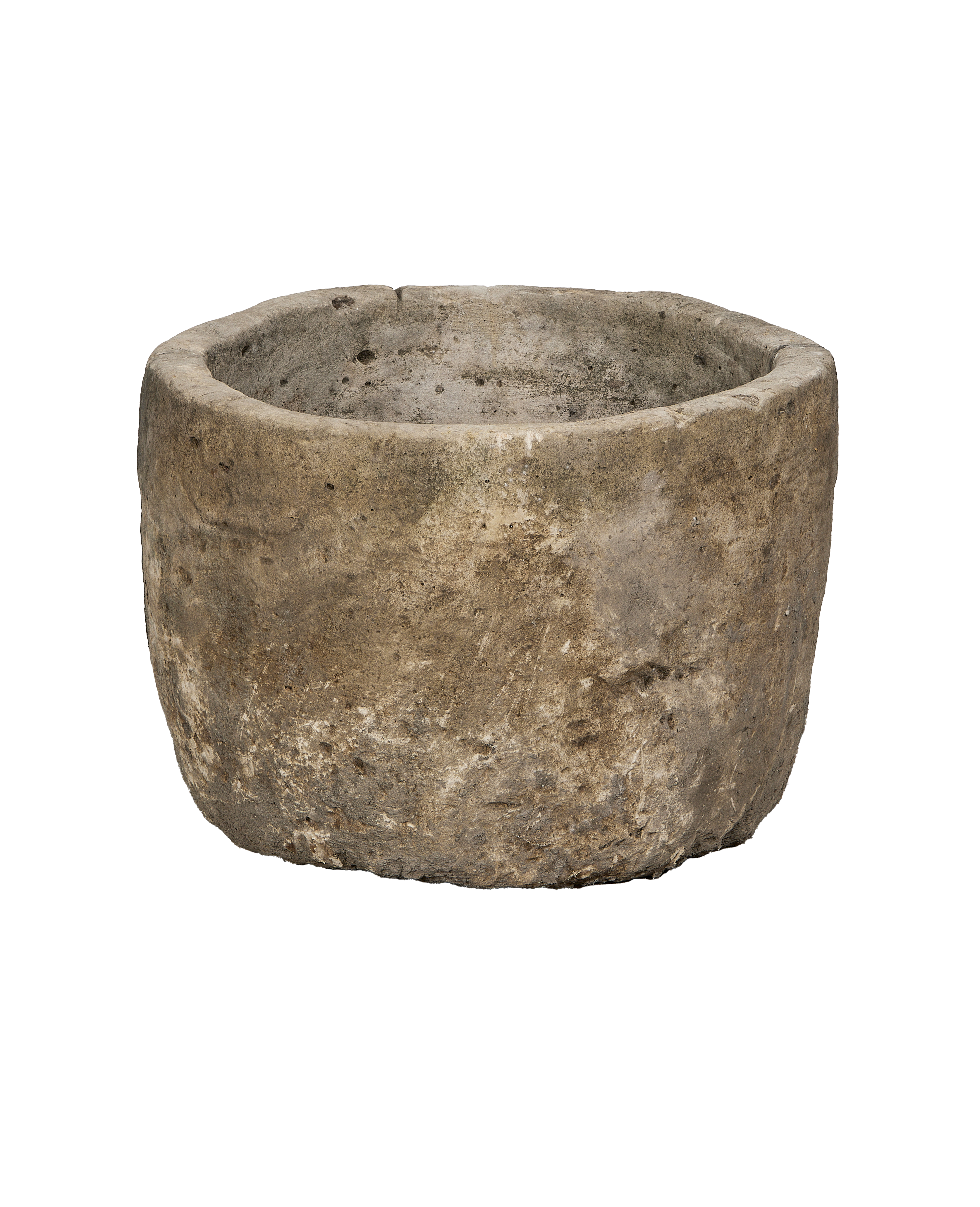 Vintage round limestone trough, Indonesia, showing textured exterior and aged patina from a mid-angle view.