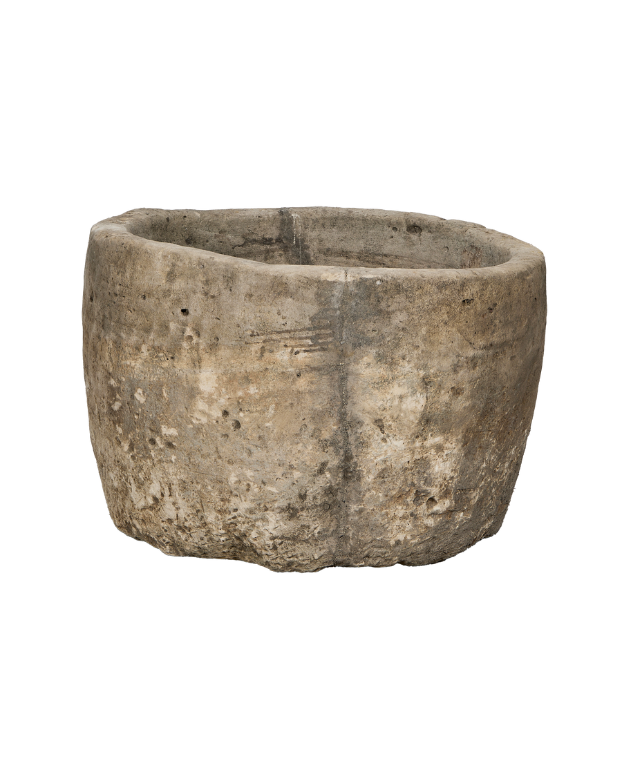 Vintage Indonesian limestone trough (OAK), slightly angled showing its weathered, porous texture.