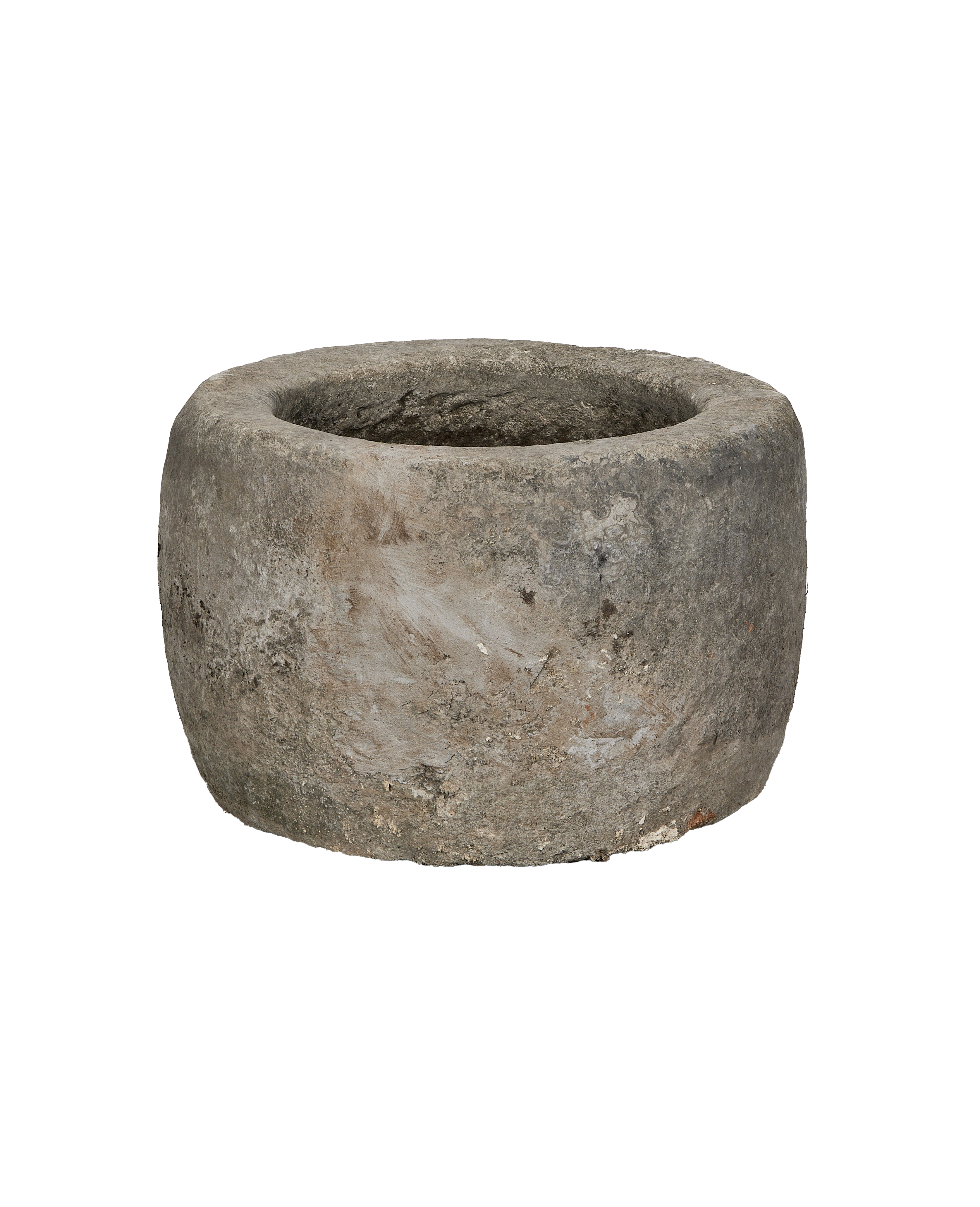 Vintage Indonesian round limestone trough, showing weathered texture from an elevated angle.