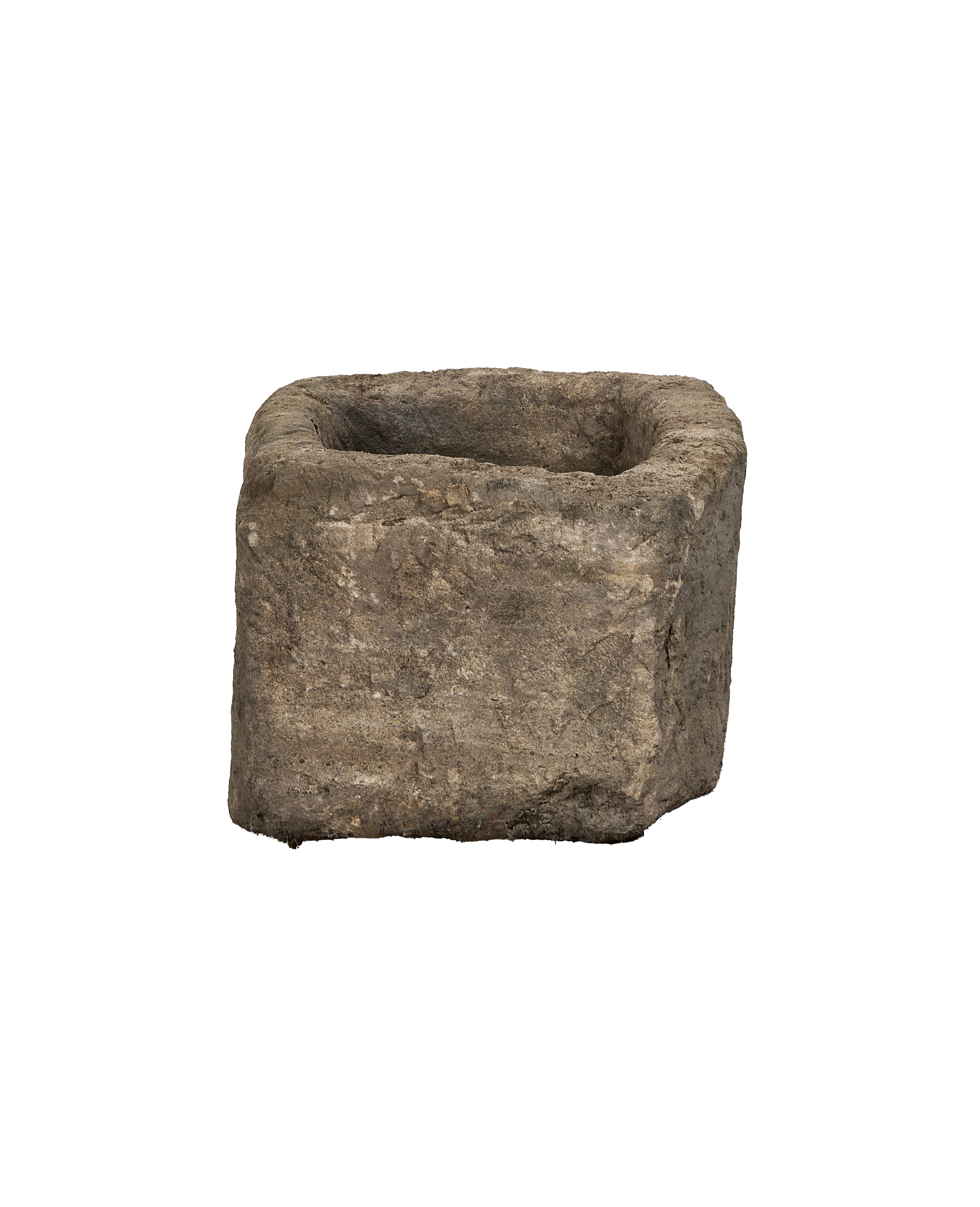 Vintage Indonesian limestone trough, dark gray and textured, showing rough sides and interior.