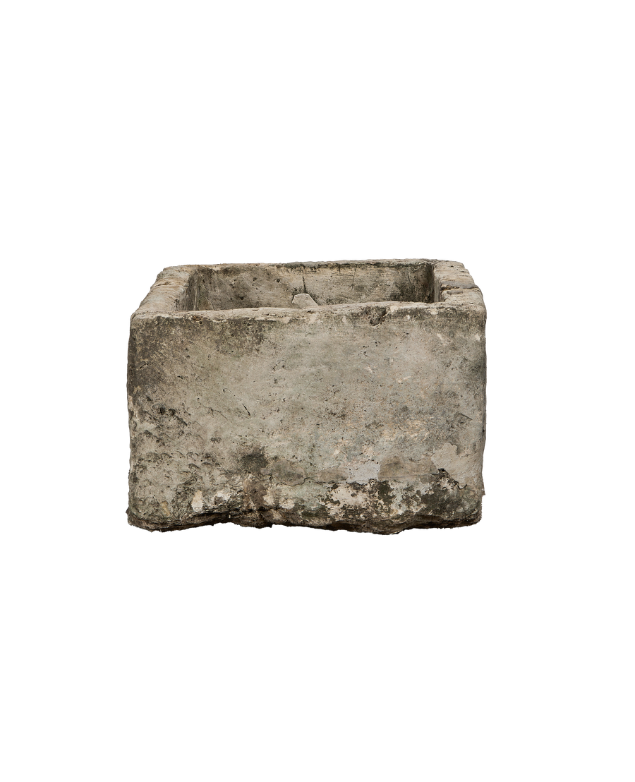 Vintage Indonesian limestone trough, showing a rugged, weathered grey finish and chipped edges.
