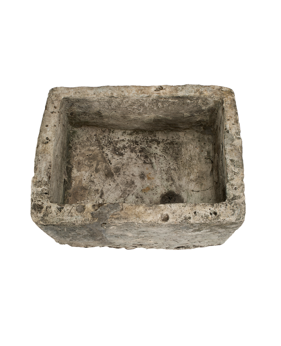 Vintage Indonesian rectangular limestone trough, visible rustic interior texture, top-down view.