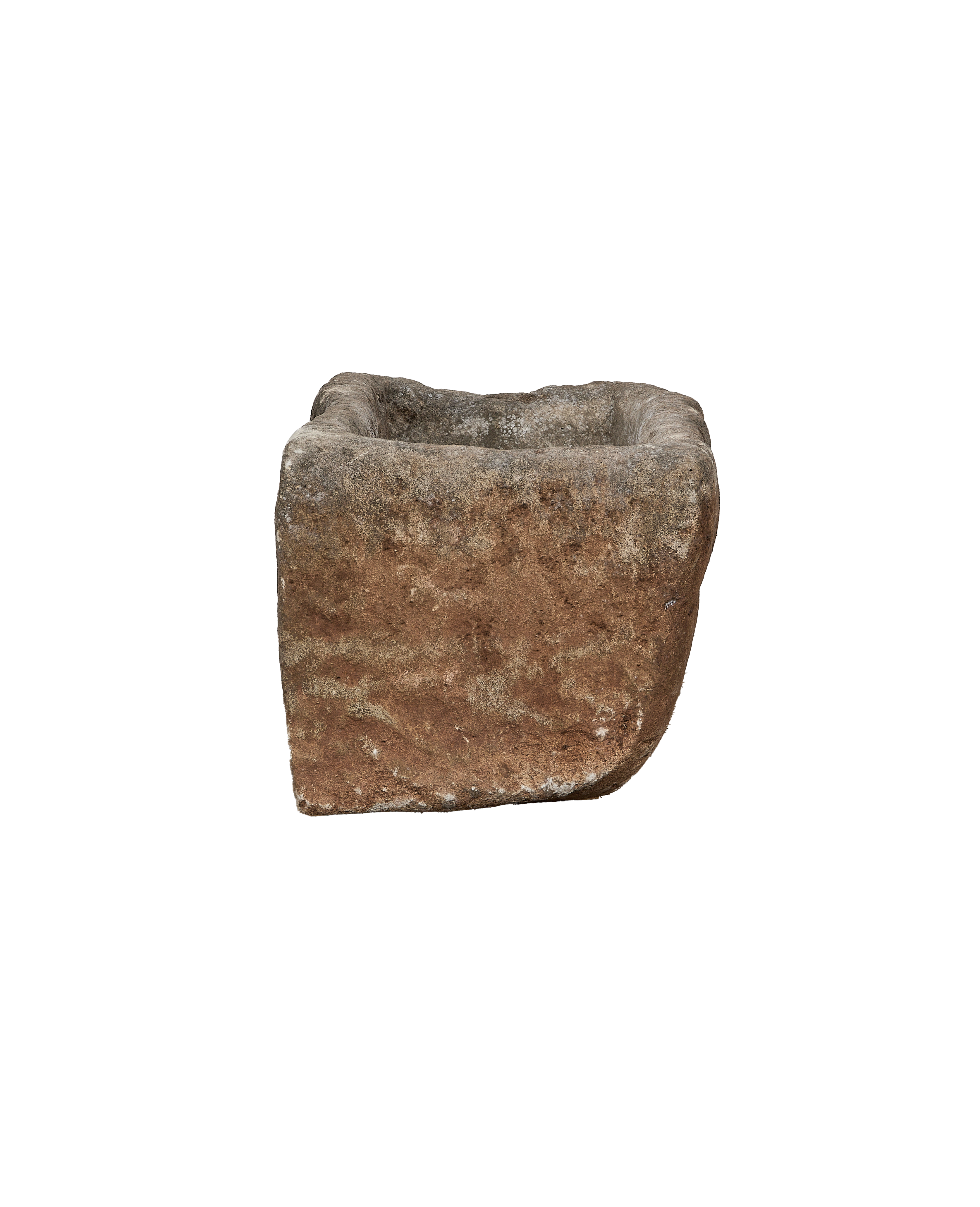 Vintage Indonesian limestone trough viewed from the side, showcasing its weathered, rustic texture.