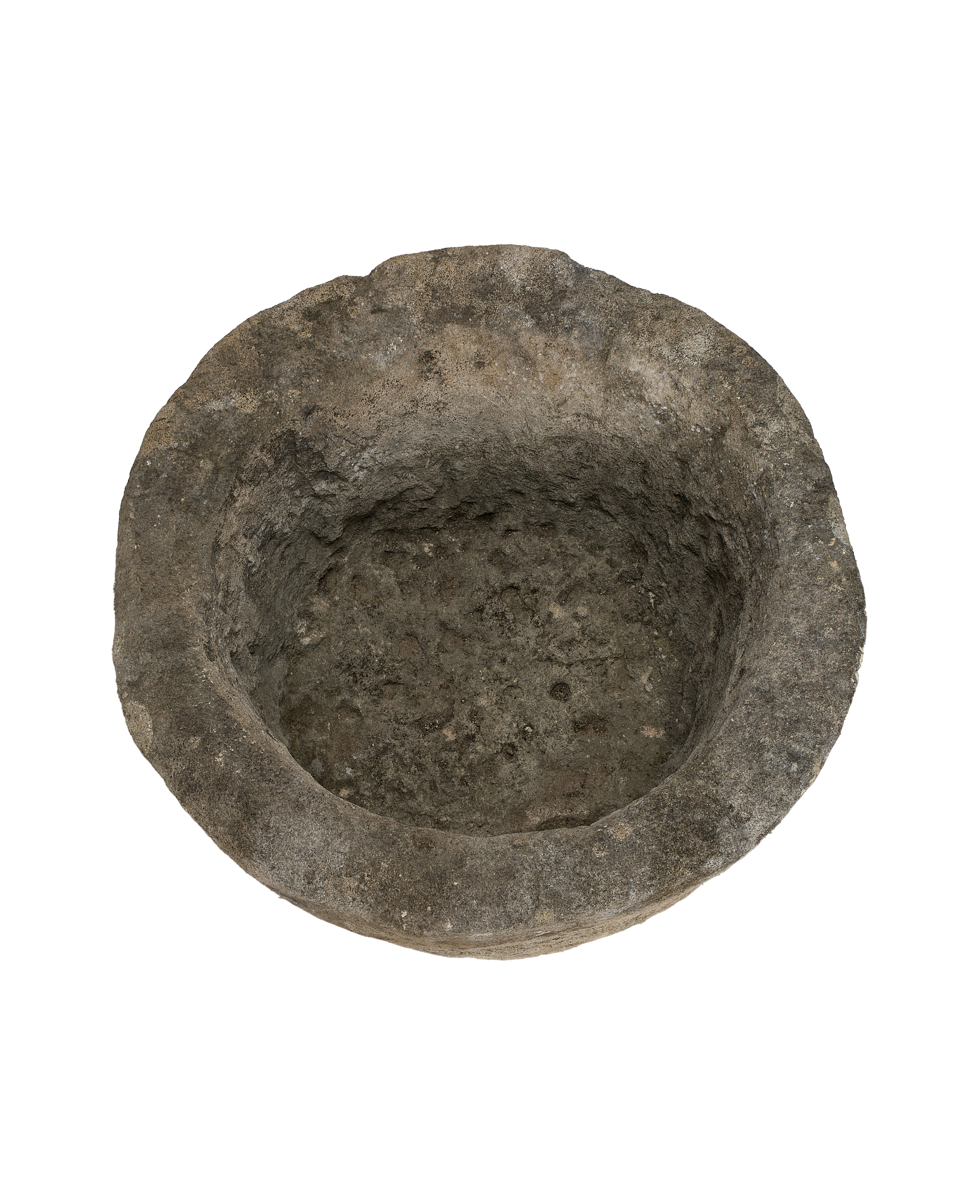 Vintage Indonesian limestone trough, top-down view highlighting the rough, weathered interior texture.