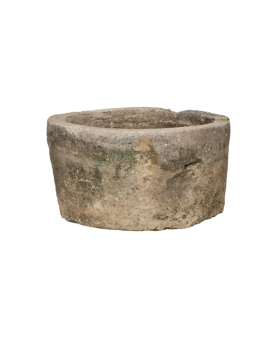 Oak vintage round limestone trough from Indonesia, with weathered exterior and moss patina.