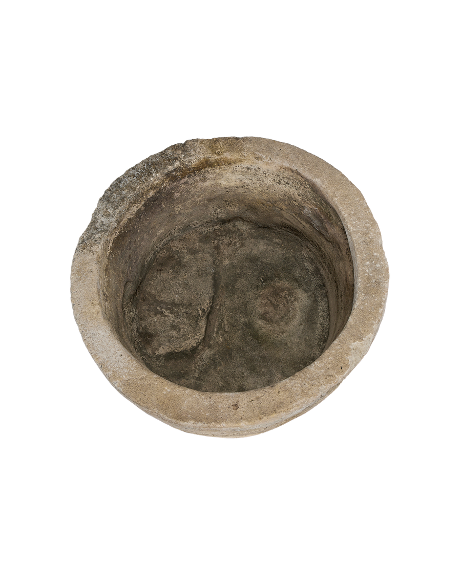 Vintage Indonesian limestone trough, top view showing weathered, deep round interior.