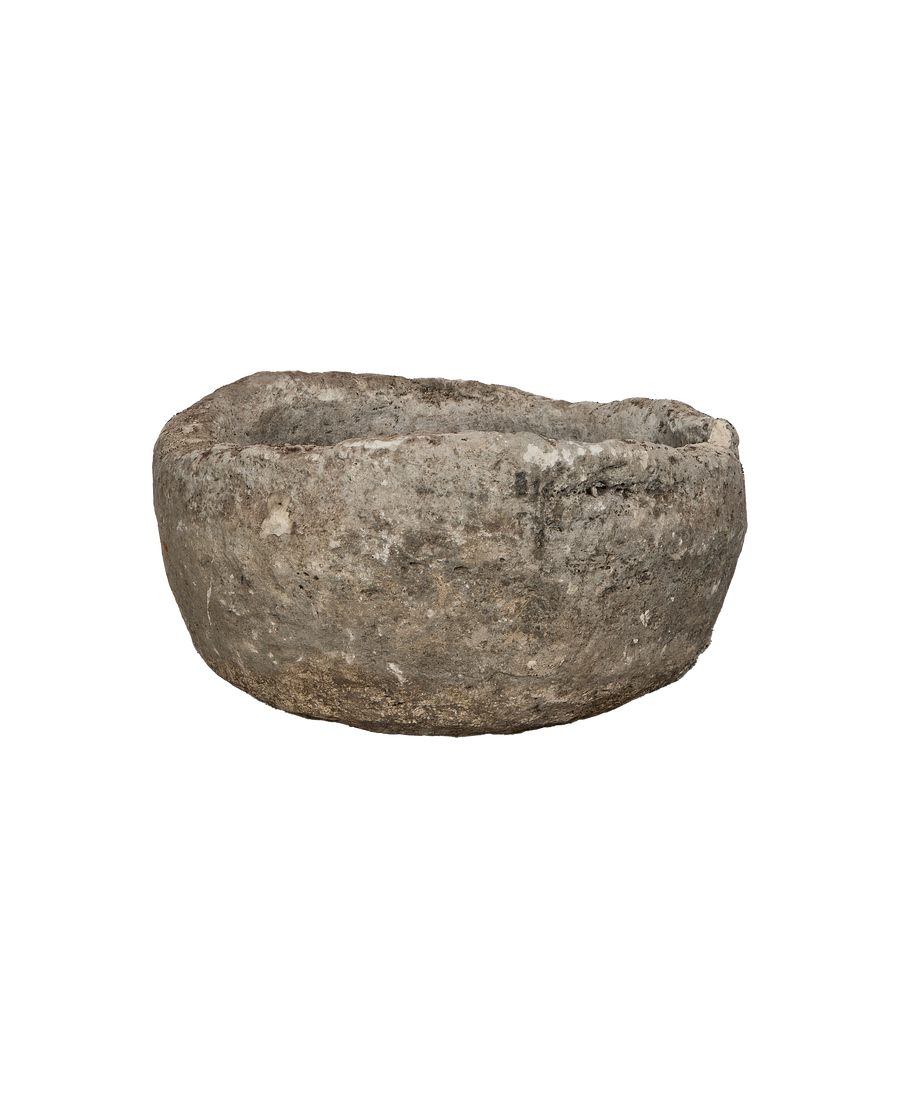 Vintage round limestone trough, side view revealing rough texture imported from Indonesia.