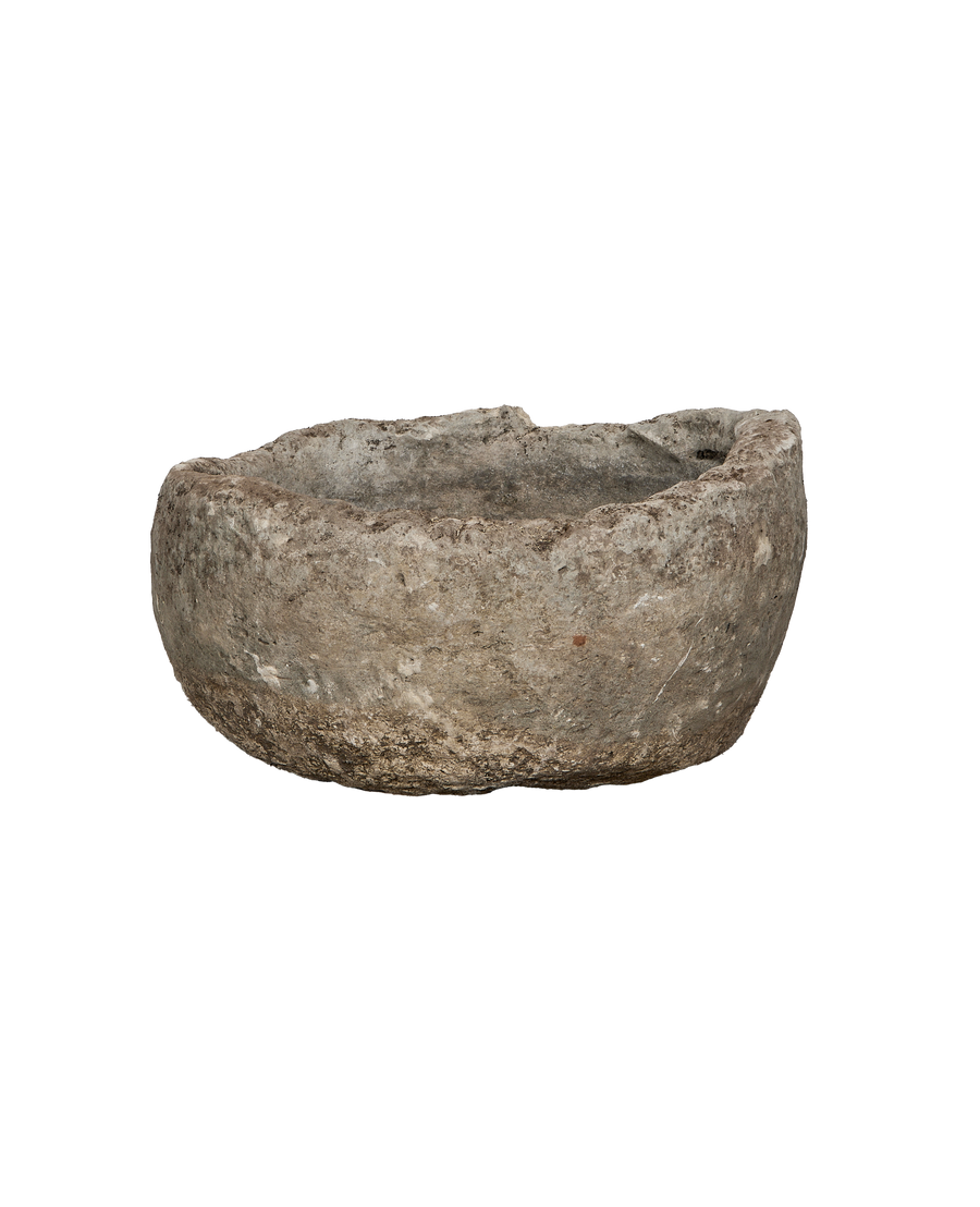 Vintage round limestone trough, aged grey patina, rough texture showing natural wear.