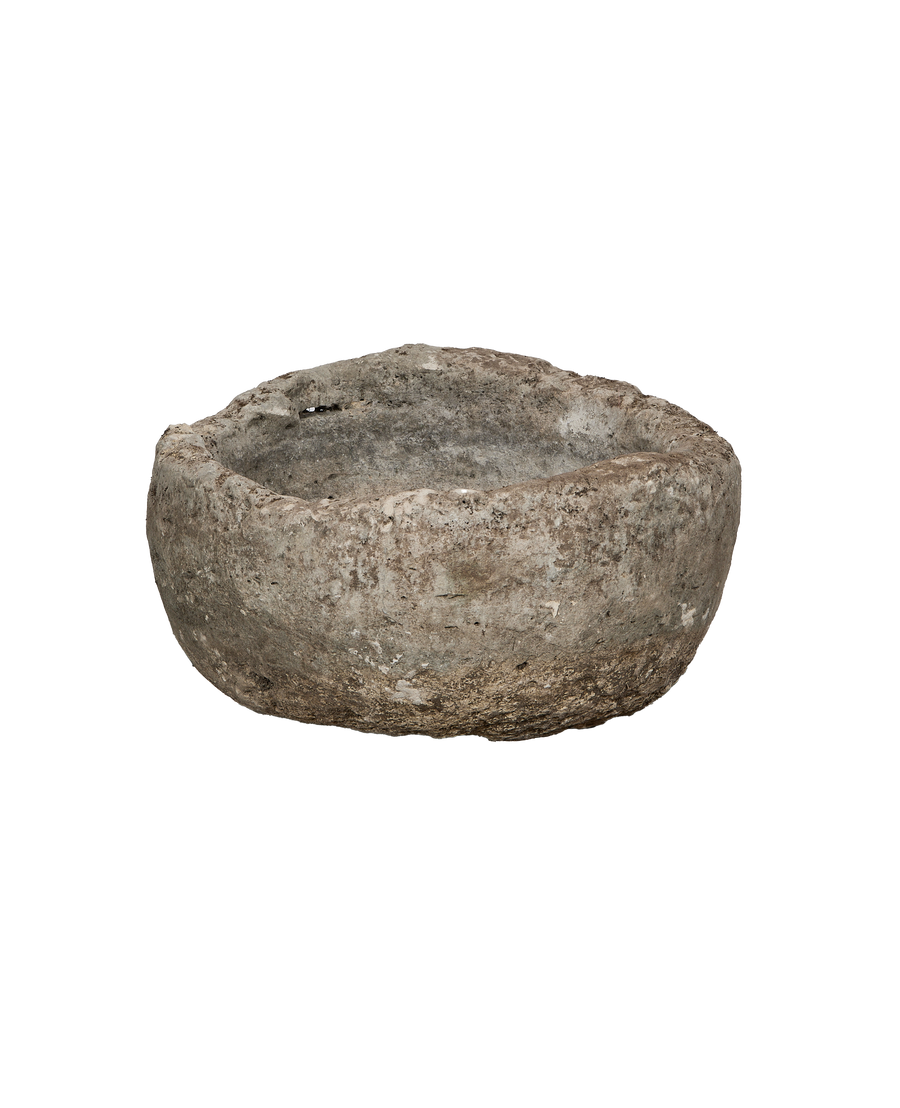 Vintage Indonesian limestone trough (OAK model) in a round shape, showing natural rough texture.