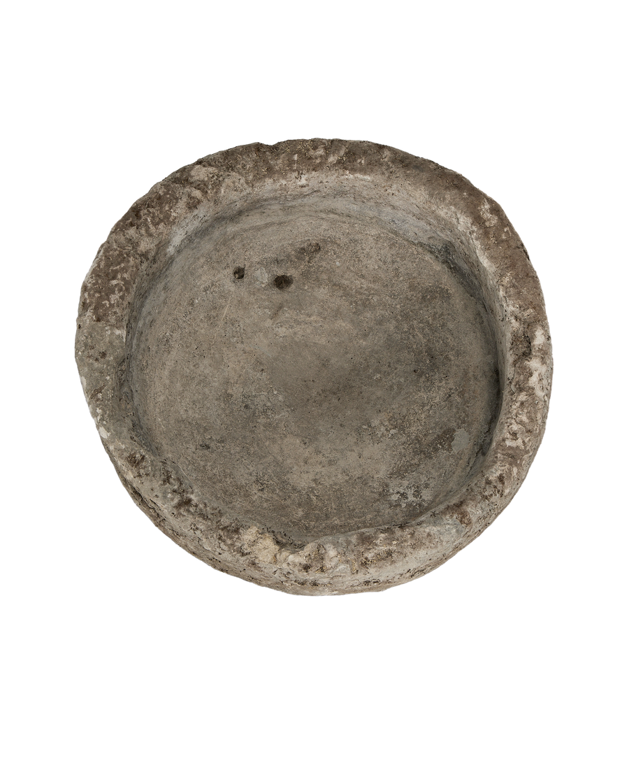 Vintage round Indonesian limestone trough, top-down view showing interior and weathered rim.