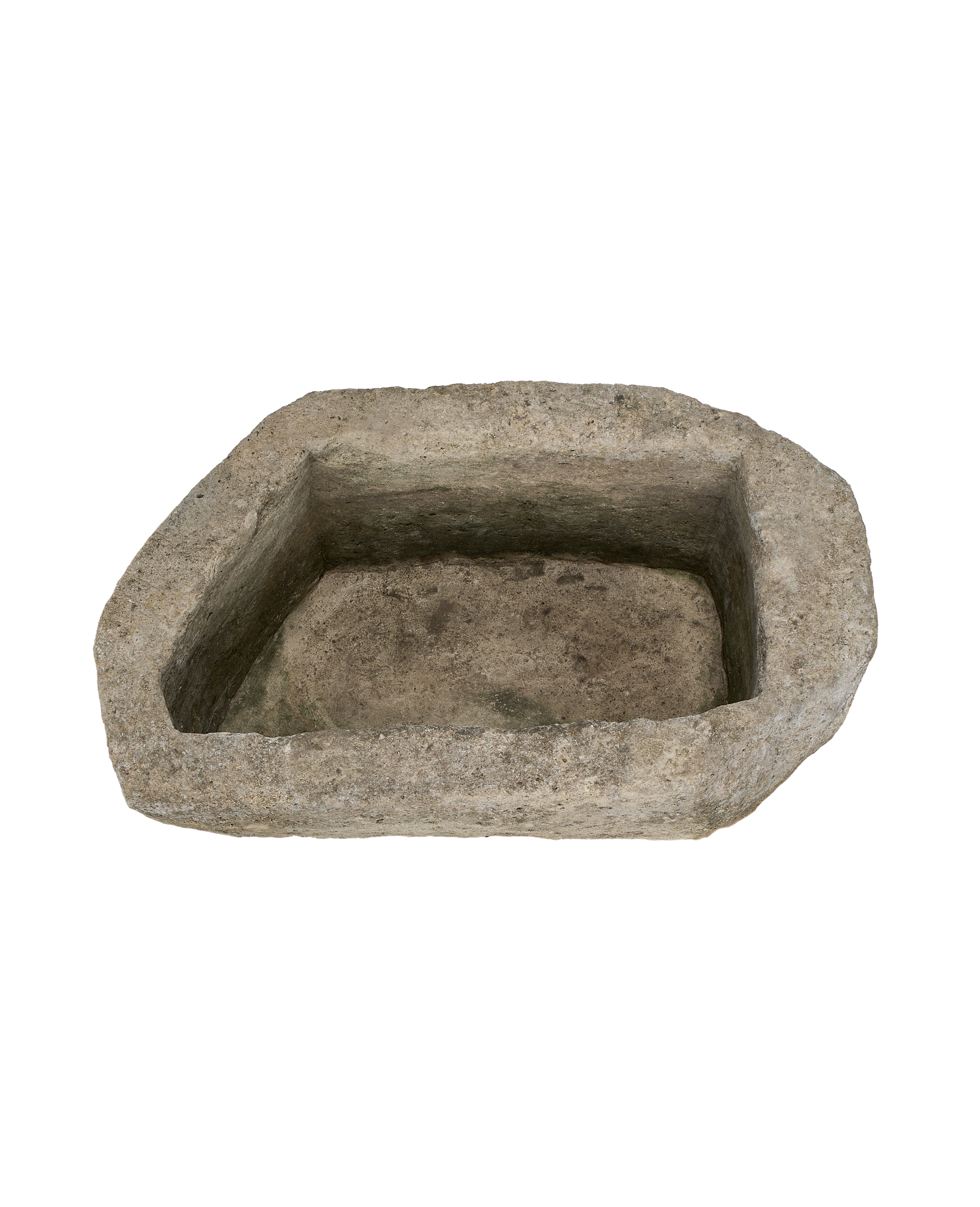 Oblong vintage limestone trough (Indonesia) showing rough, weathered interior basin texture.