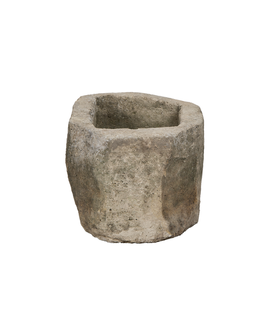 Vintage oblong Indonesian limestone trough showing weathered exterior texture and robust form.