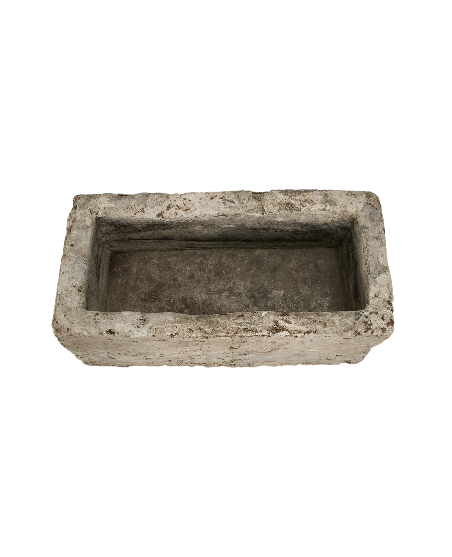 Vintage Indonesian rectangular limestone trough, top-down view showing interior texture.