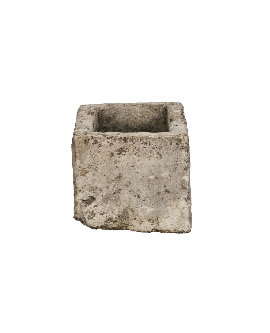 Vintage Indonesian rectangular limestone trough, showcasing rustic texture, an eroded short side, and open top.