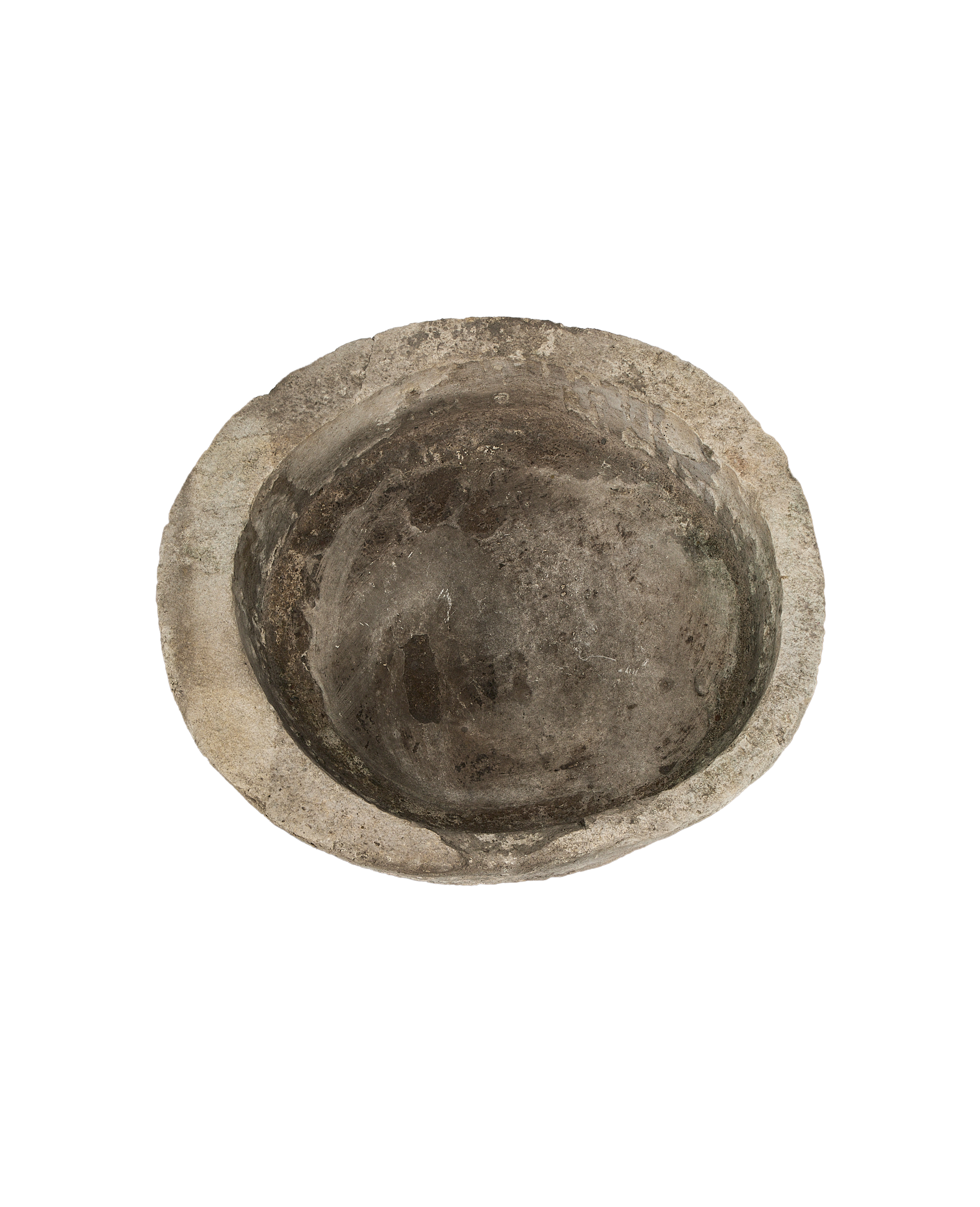 Vintage Indonesian round limestone trough, top-down view showing weathered, textured interior.