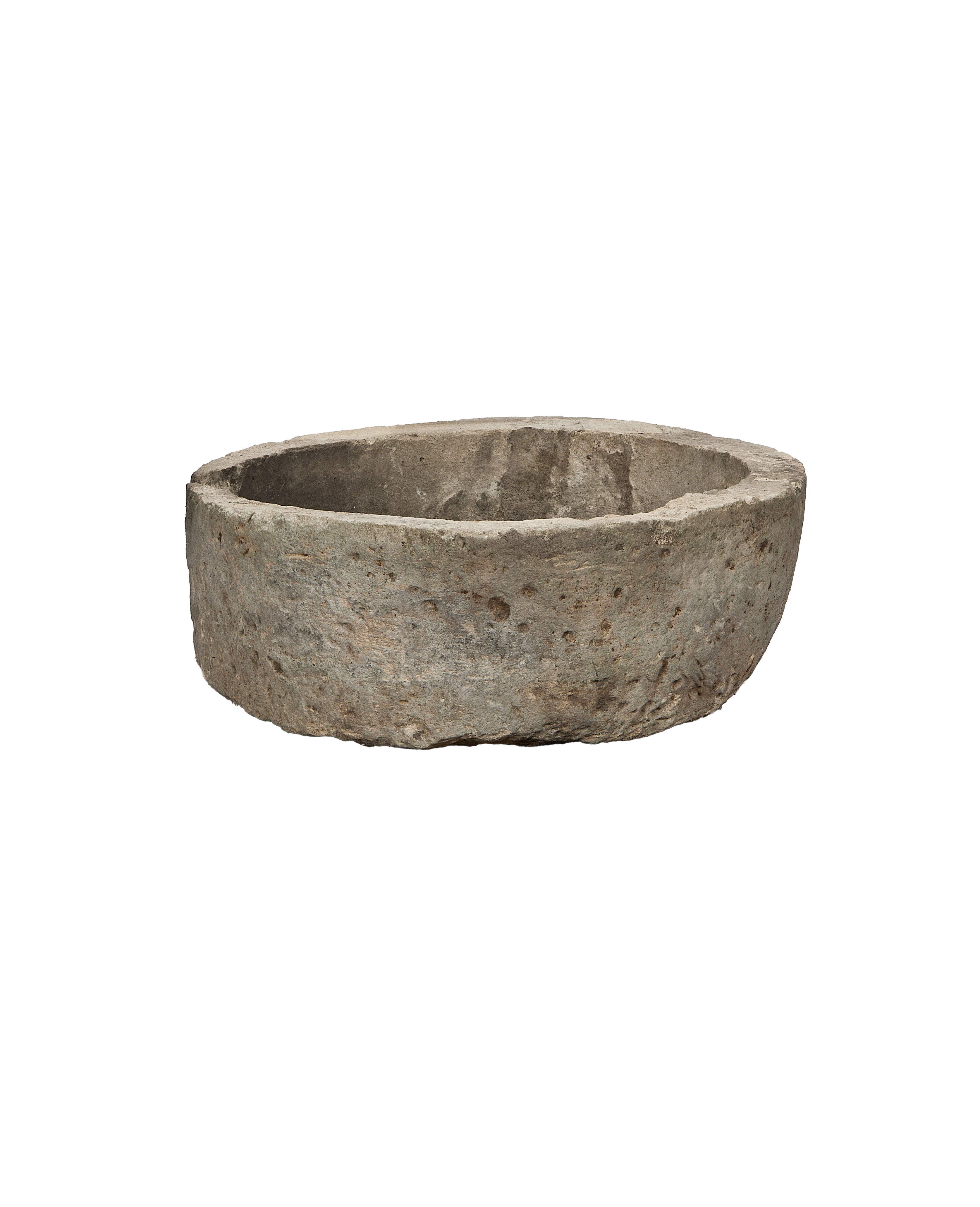 Vintage Indonesian round limestone trough, aged rustic texture from an overhead angle.