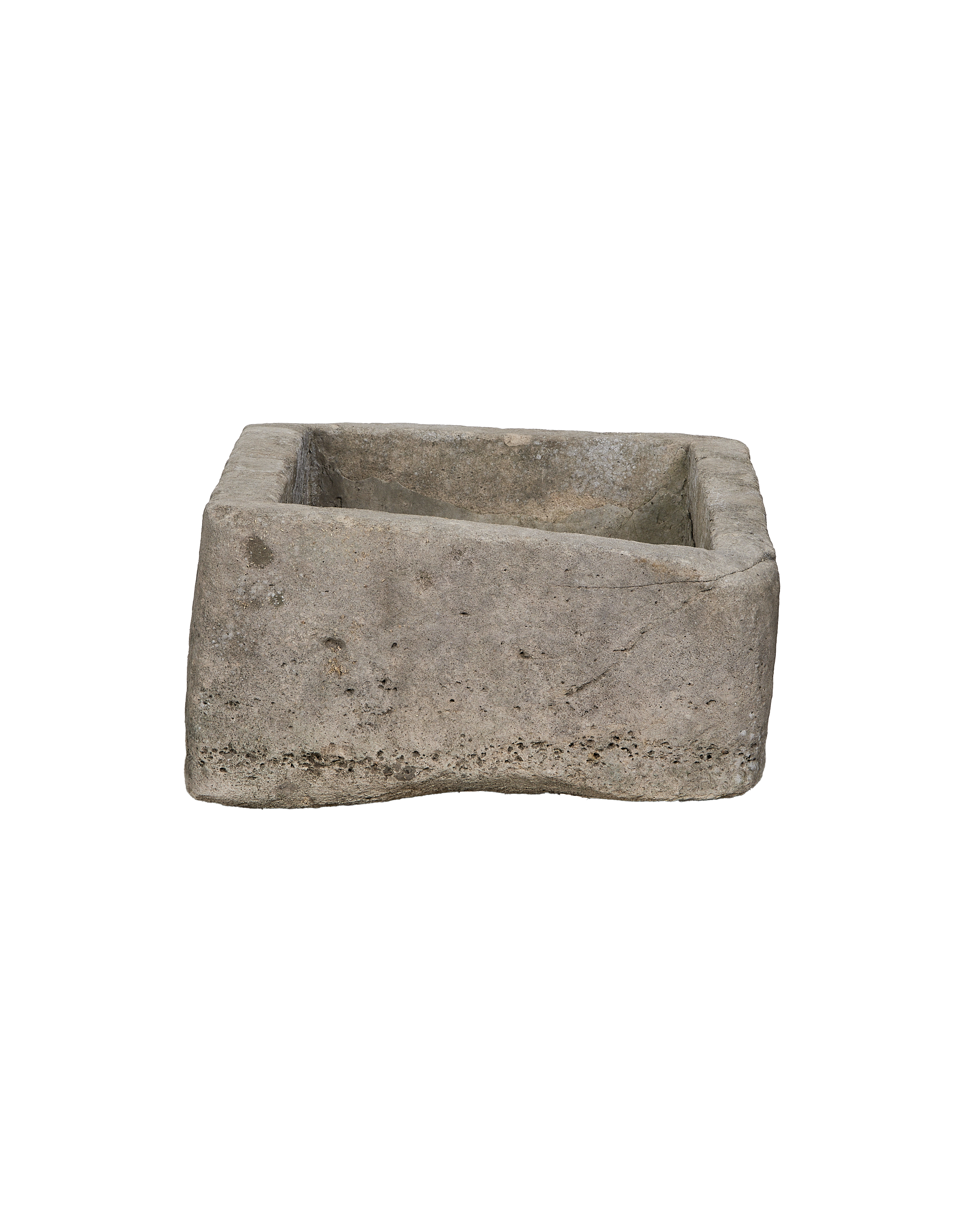 Vintage Indonesian rectangular limestone trough showing a raw, rough-hewn exterior side.