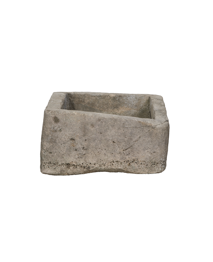 Vintage Indonesian rectangular limestone trough showing a raw, rough-hewn exterior side.