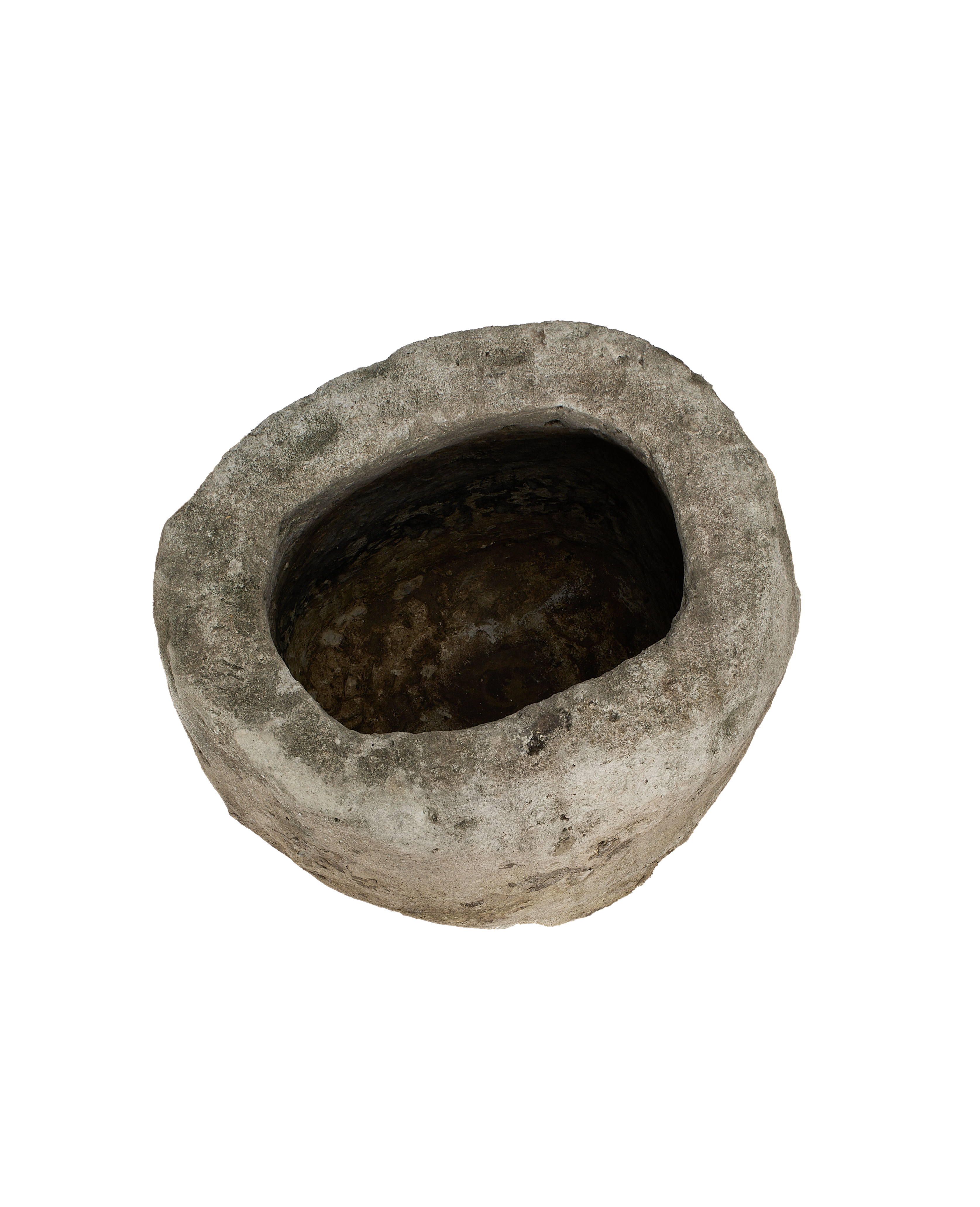 Vintage Indonesian oblong limestone trough, dark weathered interior with rough exterior texture.