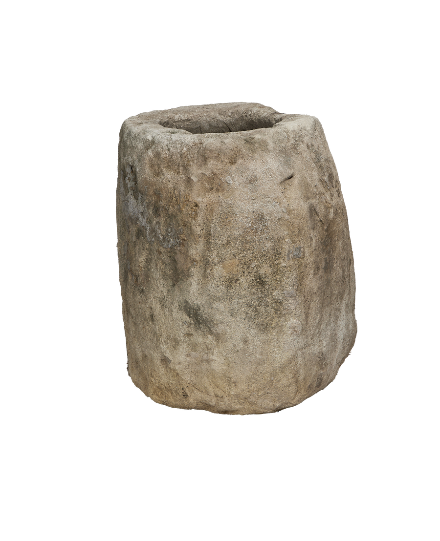 Vintage limestone trough from Indonesia, weathered surface and organic oblong shape.