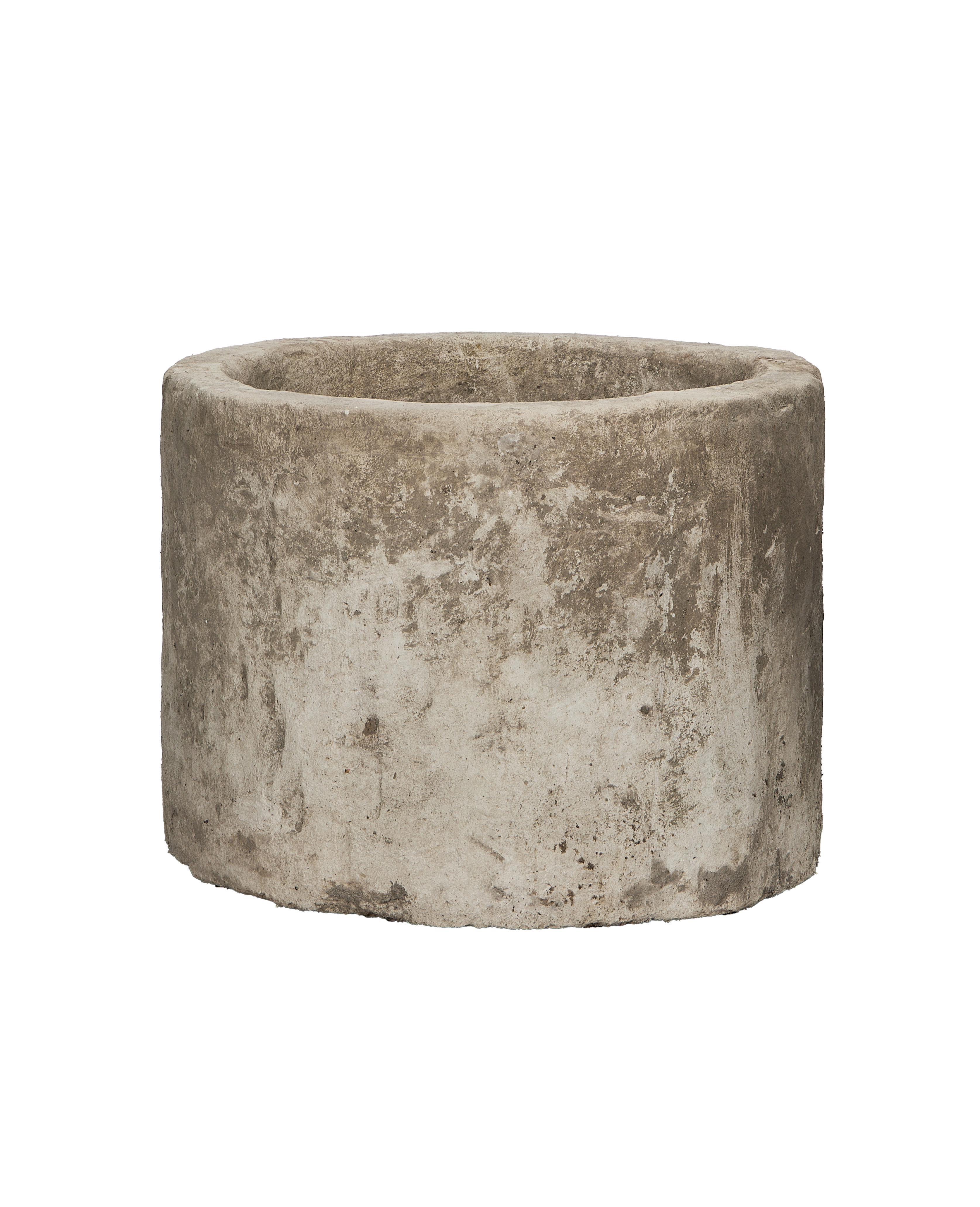 Vintage round Indonesian limestone trough showing weathered, textured surface and top edge.