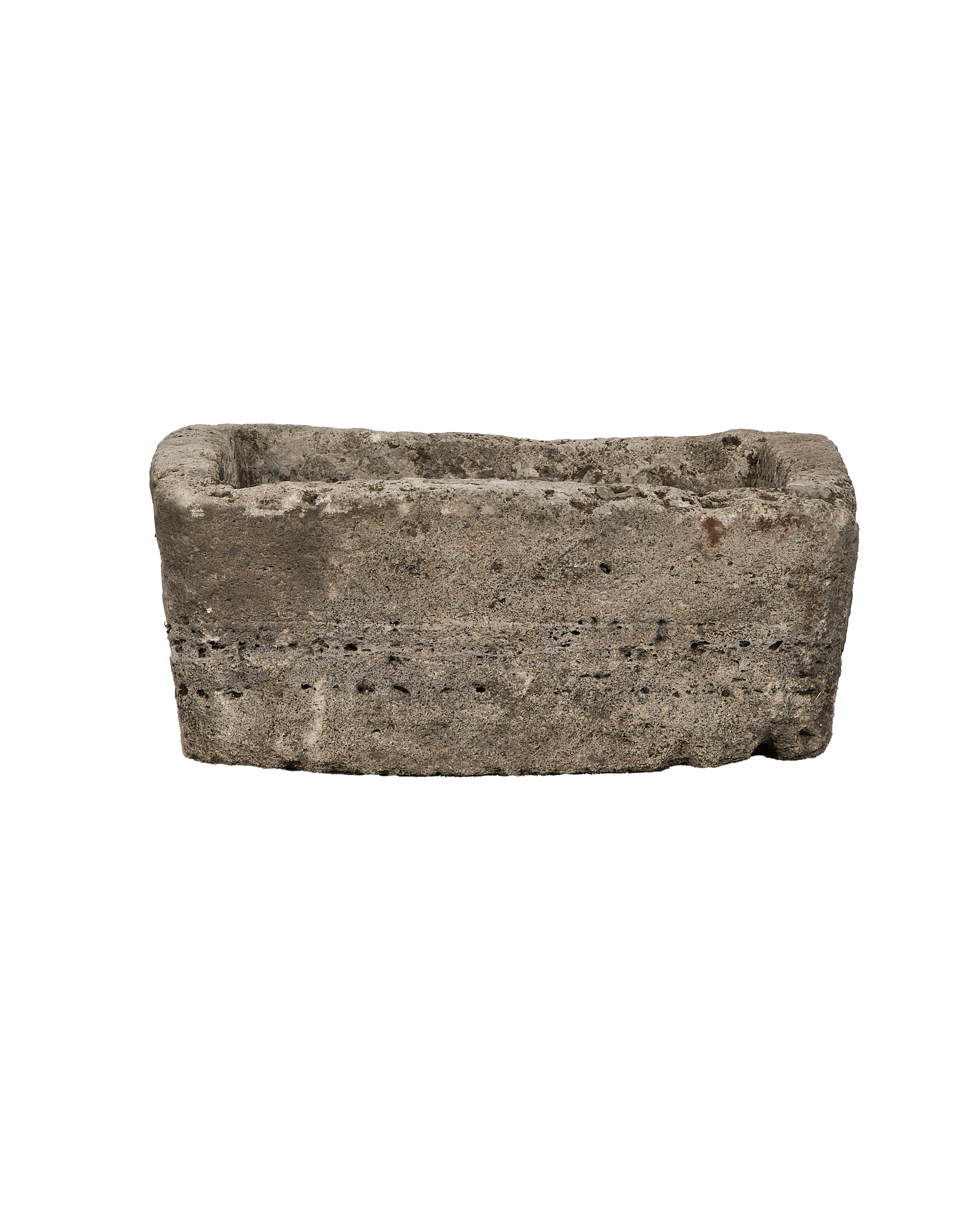 Vintage rectangular limestone trough, showing weathered texture and small holes along the unpolished body.