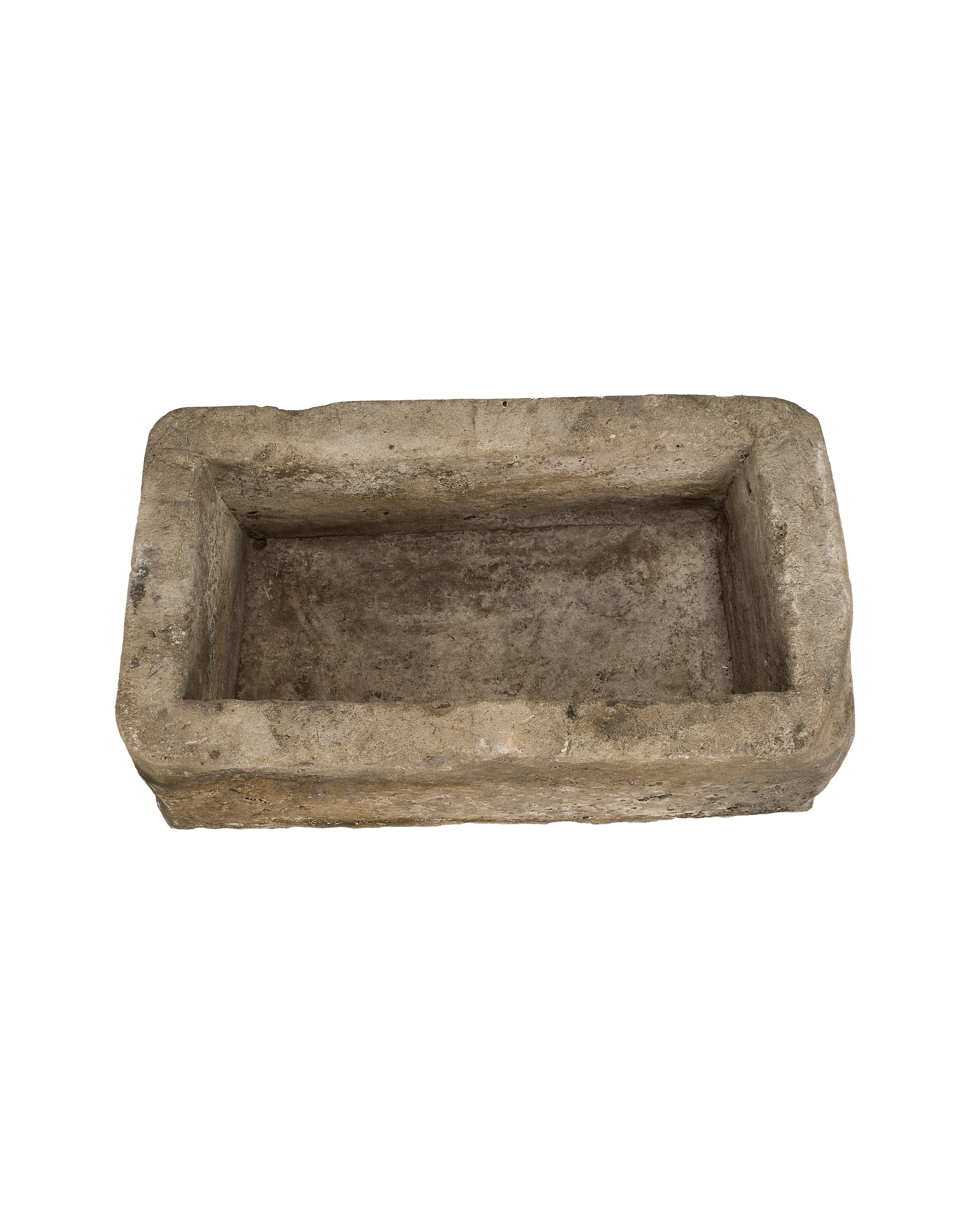 Top-down view of a rectangular vintage Indonesian limestone trough with weathered texture.