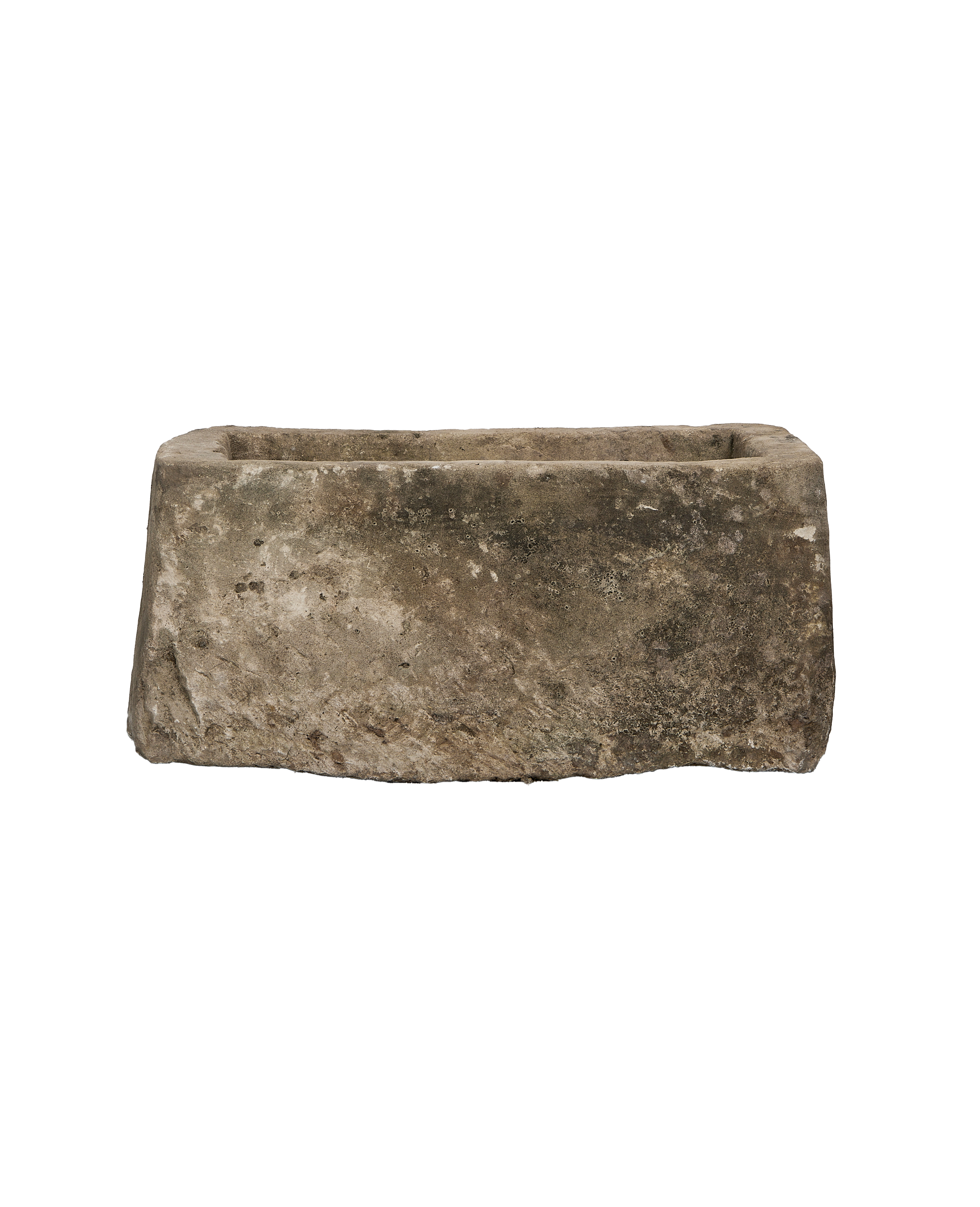 Vintage Indonesian limestone trough, showing a side view with aged, textured surface.
