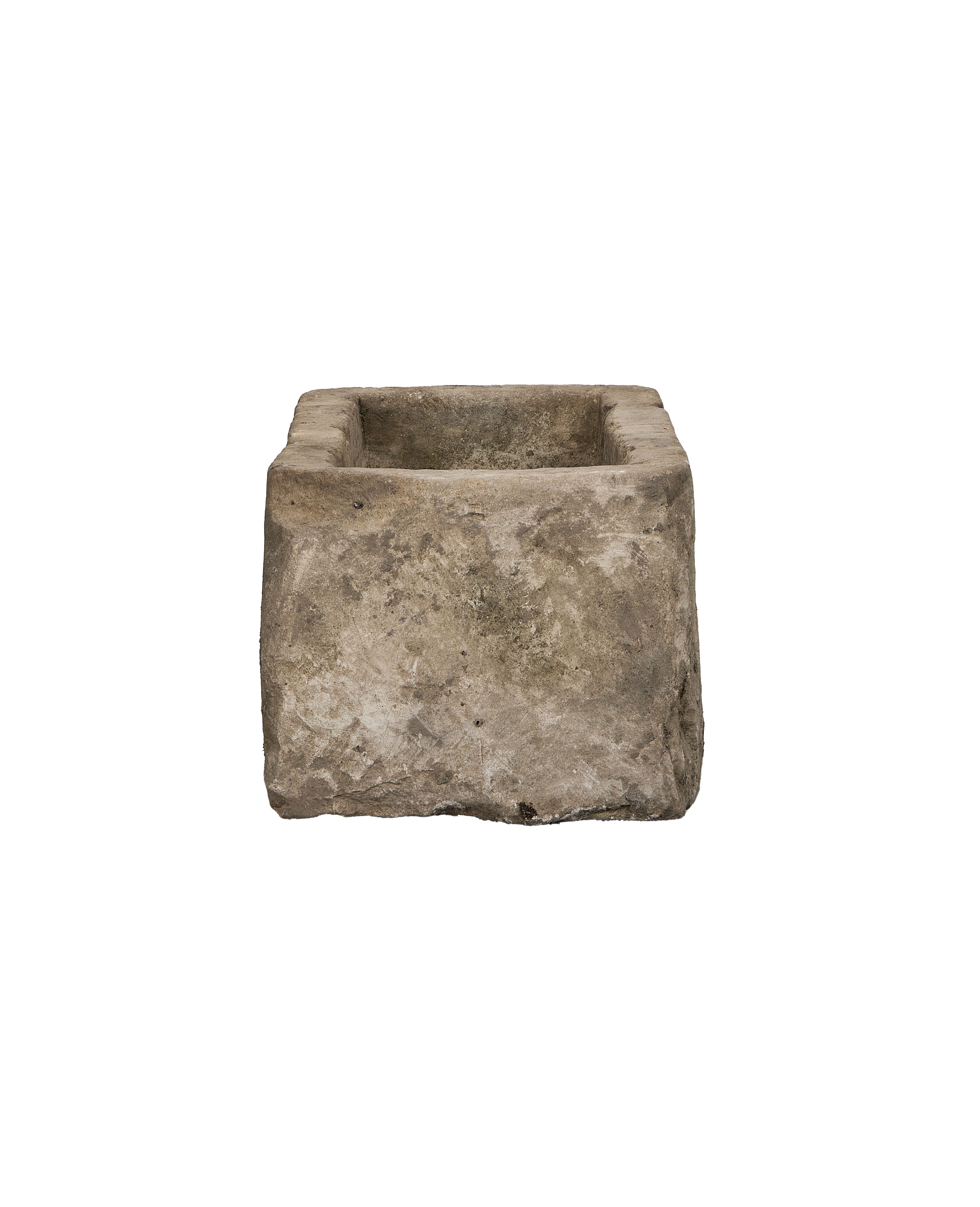 Vintage Indonesian limestone trough, close-up of rough textured stone surface and worn edges.