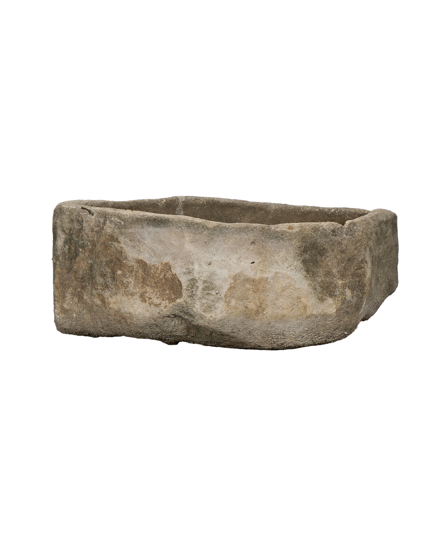 Vintage oblong limestone trough, weathered Indonesian garden planter, showcasing textured sides and natural patina.