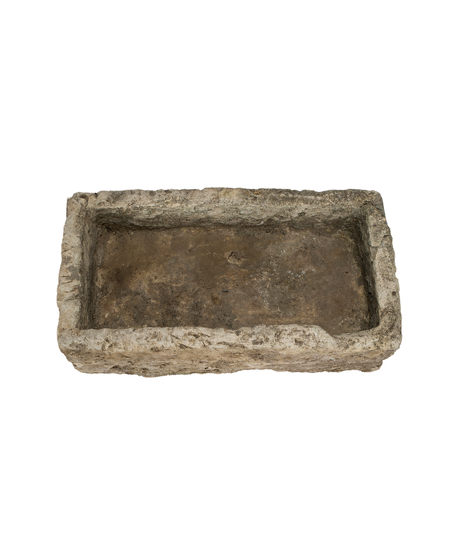 Vintage Indonesian rectangular limestone trough, rustic texture, top-down internal view.