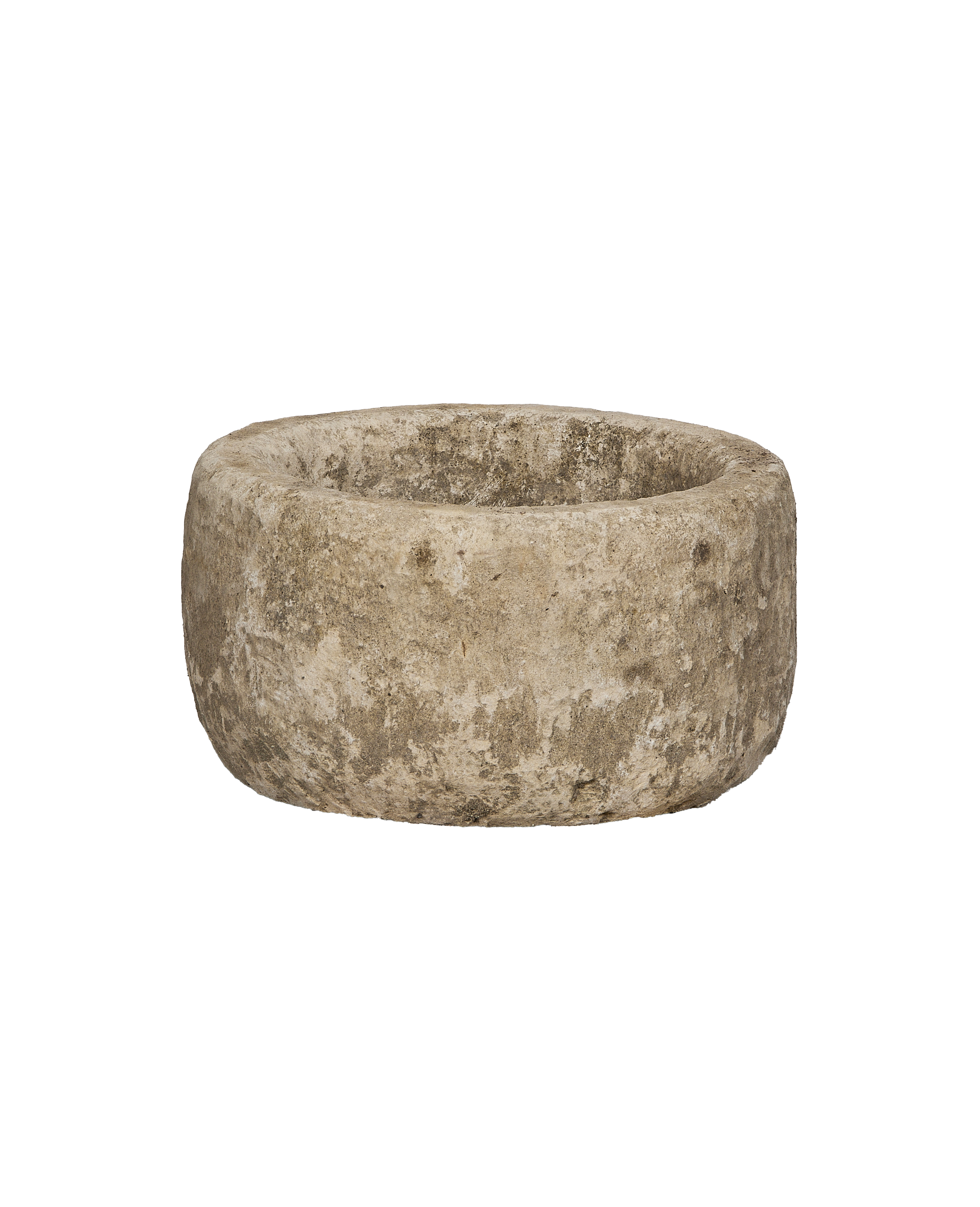Vintage Indonesian round limestone trough, showing weathered texture from an elevated angle.