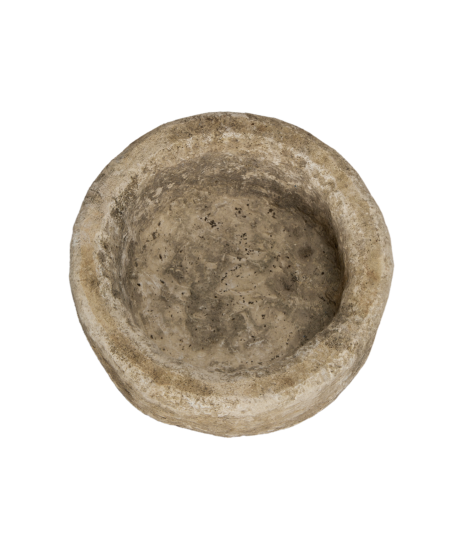Vintage round Indonesian limestone trough, top view shows weathered texture and depth.