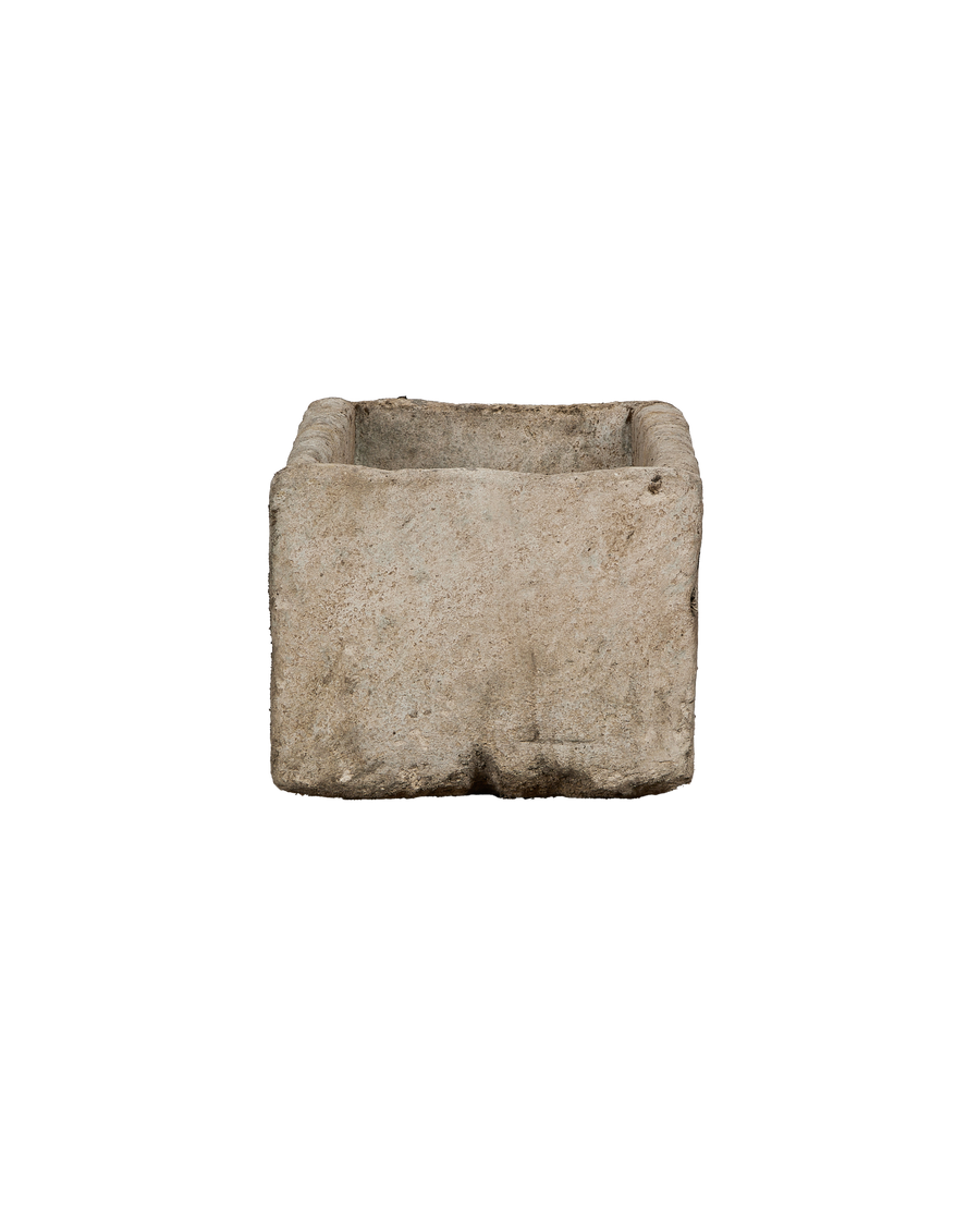 Vintage limestone trough from Indonesia, weathered with a rustic, textured side view.