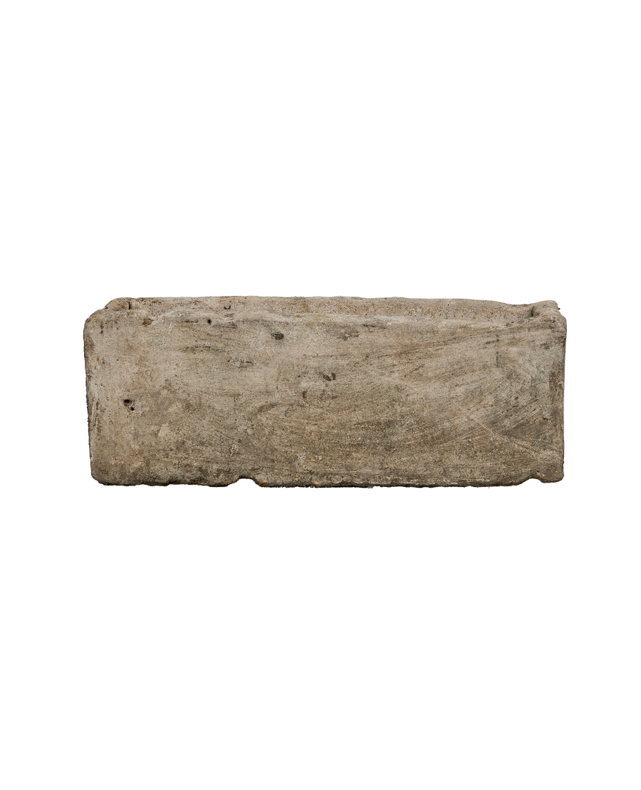 Vintage Indonesian limestone trough, rectangular, OAK, with textured, weathered surface detail, side view.