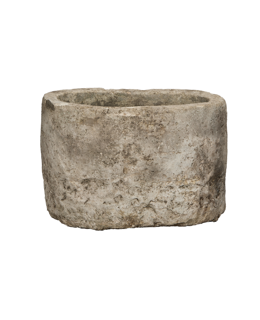 Vintage limestone trough from Indonesia, weathered exterior texture, displaying top opening.