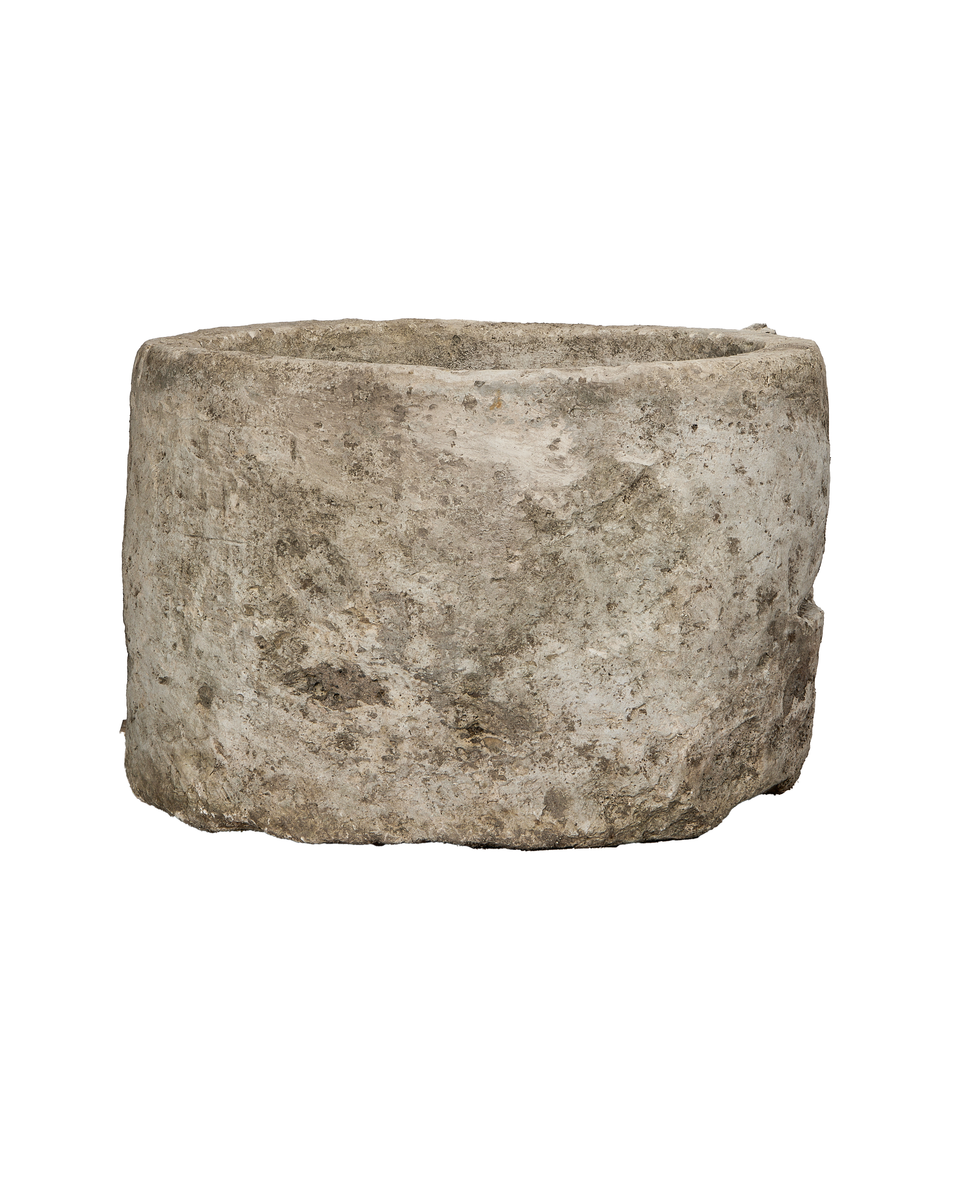 Vintage oblong Indonesian limestone trough, OAK, with textured, weathered exterior from wide side angle.