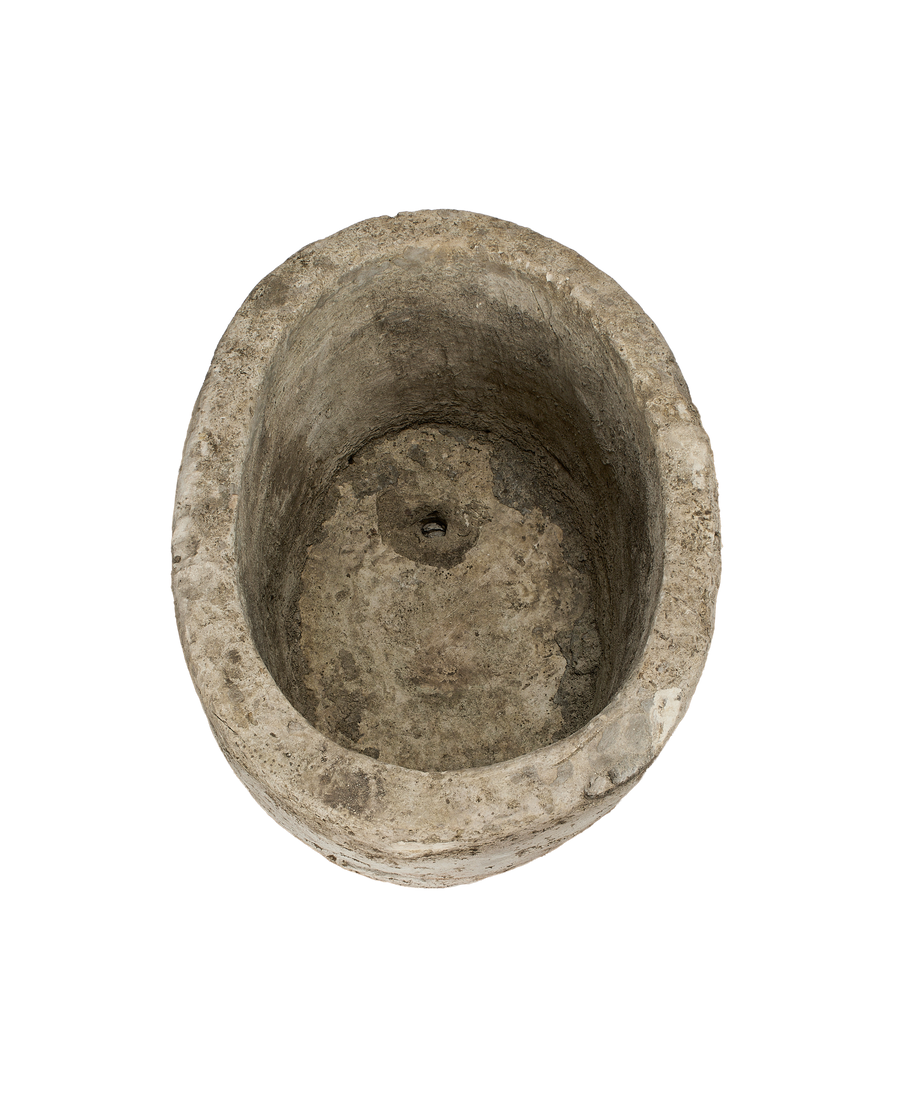 Vintage Indonesian oblong limestone trough, inside close-up, showing weathered interior and drain hole.