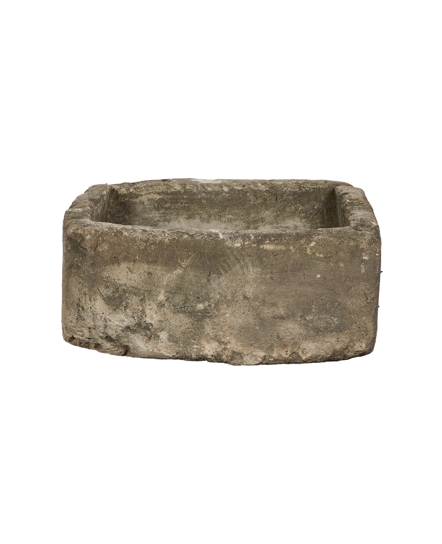 Front view of square vintage Indonesian limestone trough with rough-hewn texture.