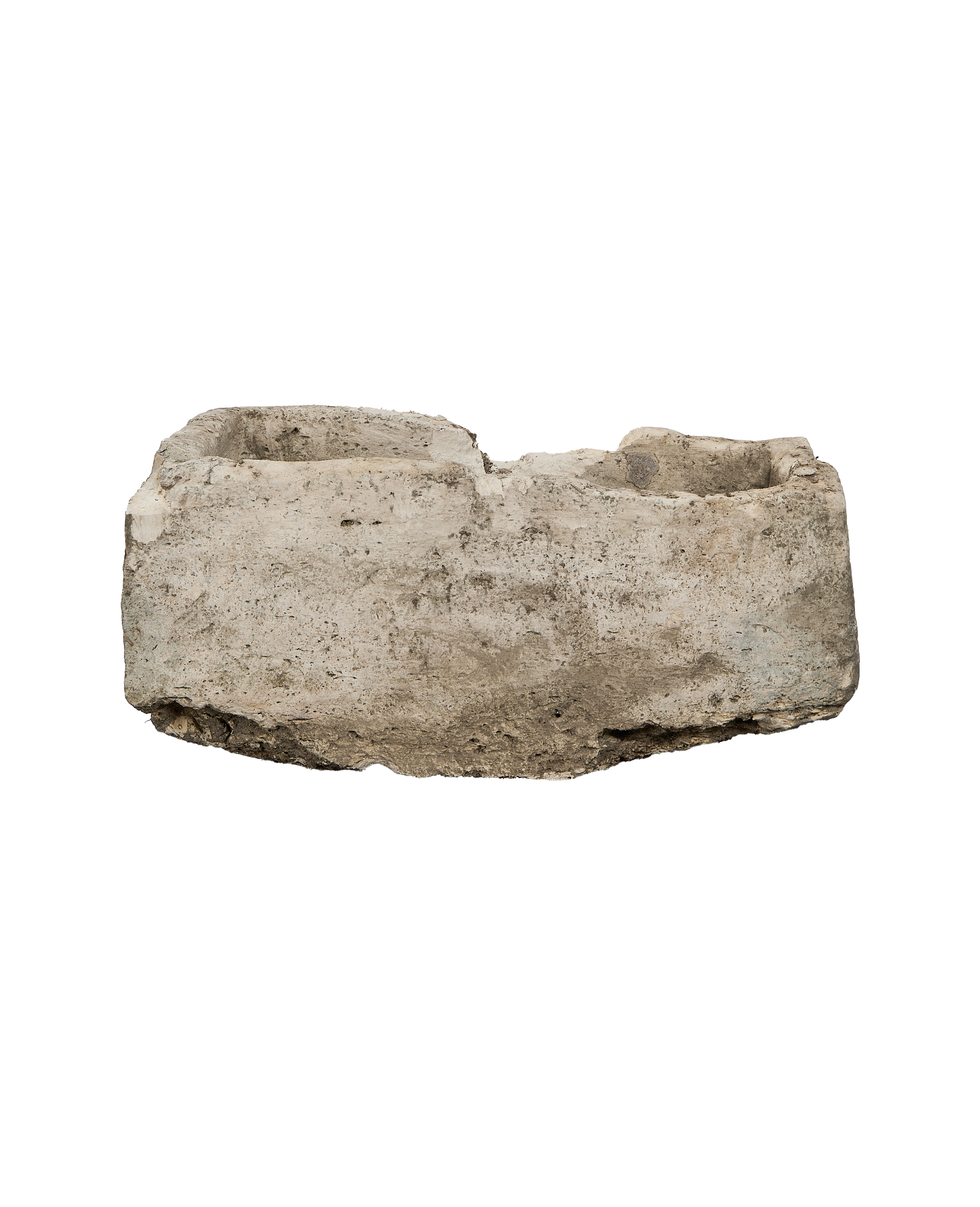 Vintage rectangle limestone trough, showing the rough, weathered texture and varied rim.