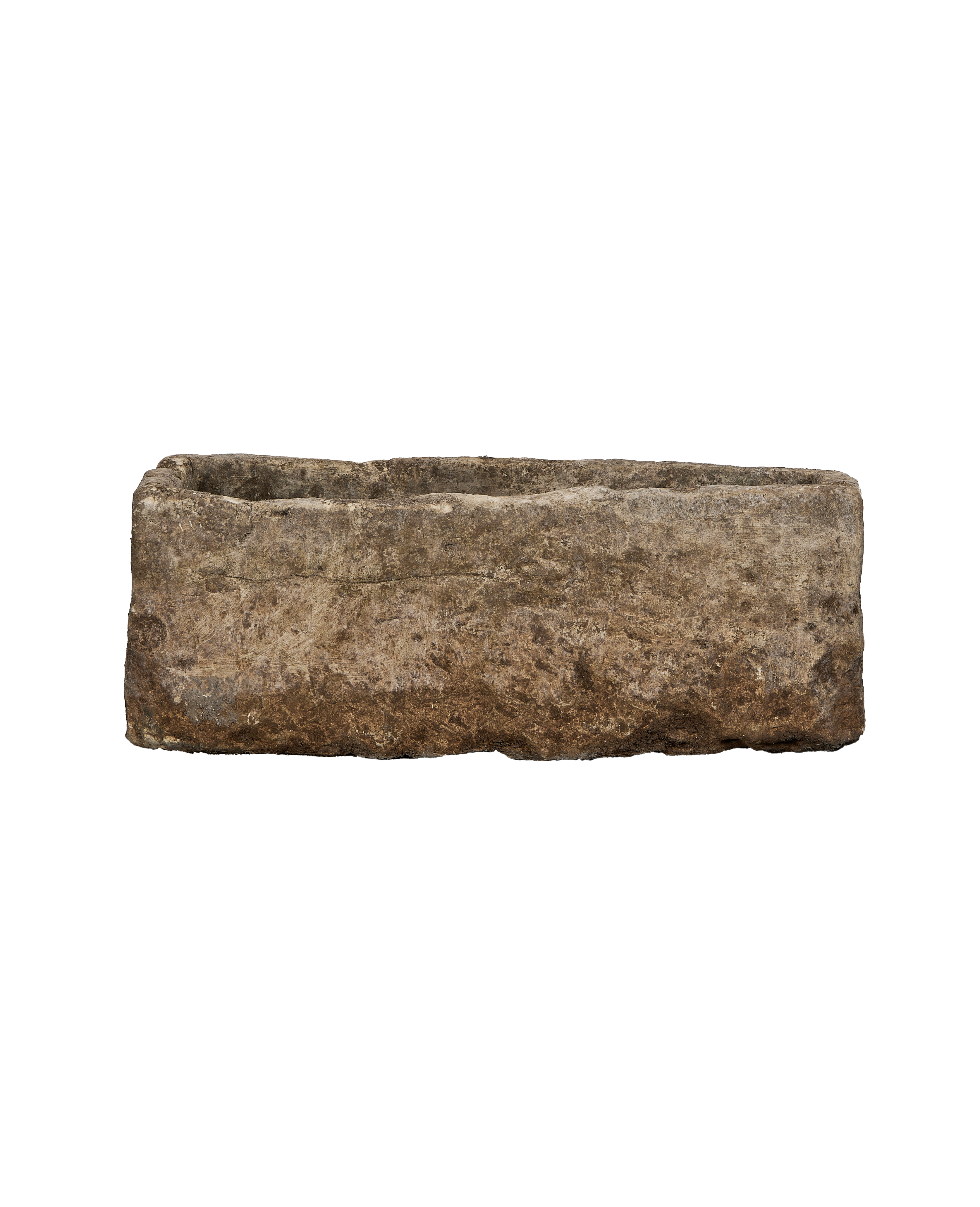 Vintage rectangular limestone garden trough in tan and gray with weathered texture.