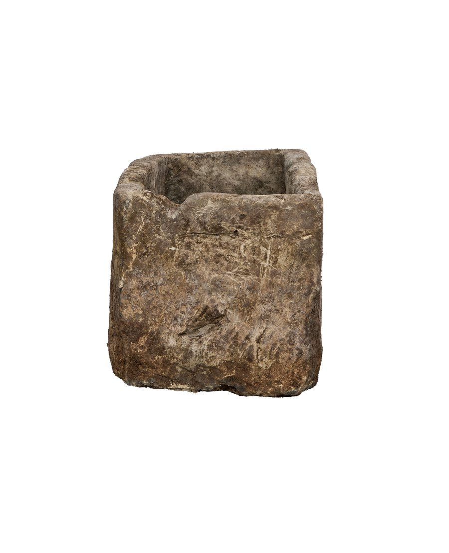 Vintage Indonesian limestone rectangular trough, showing an uneven, textured side with distressed surface and top opening.
