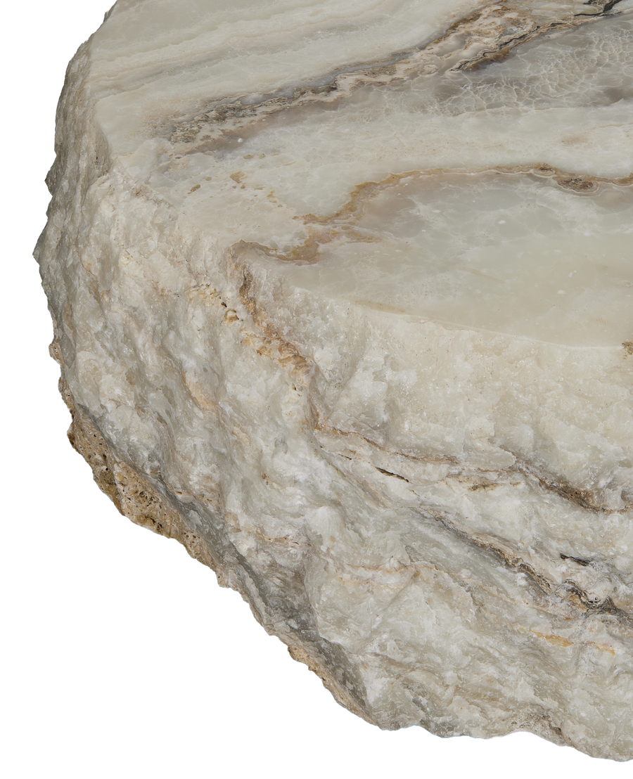Raw edge of onyx slab, showcasing detailed natural texture and veining.