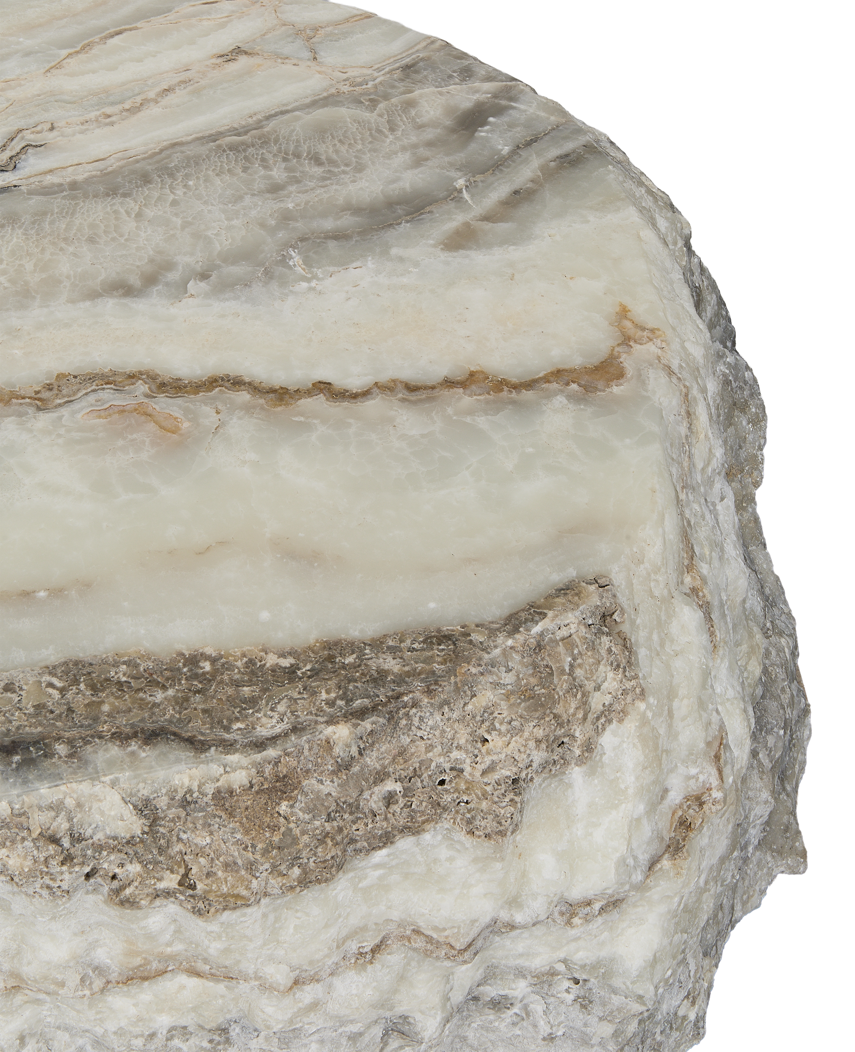 Close-up of the onyx coffee table's raw, variegated slab edge showcasing natural rough texture.